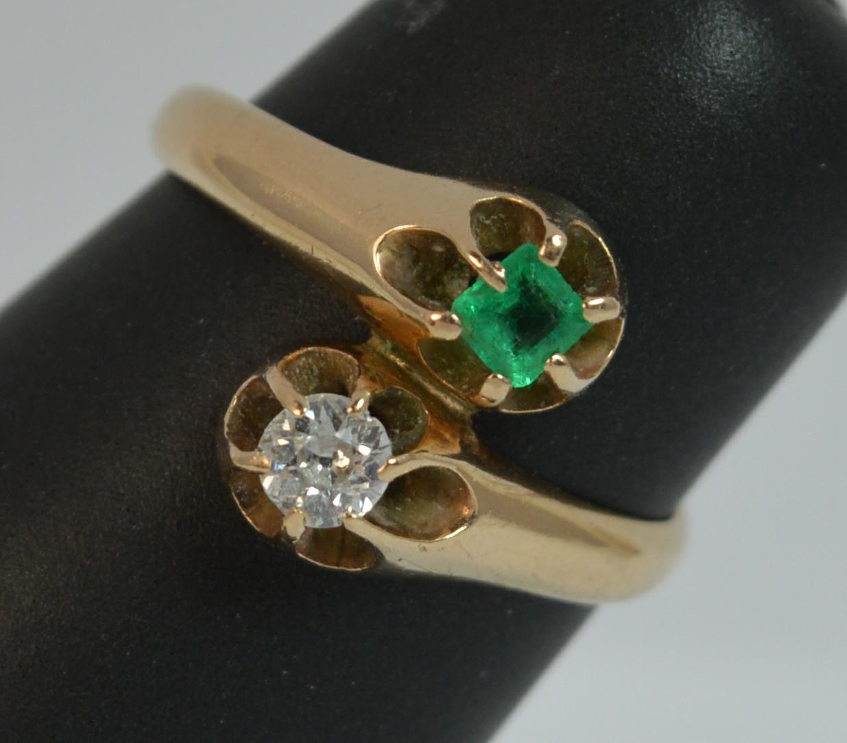 
A LADIES DIAMOND, 14ct GOLD EMERALD AND DIAMOND RING.

A TRUE ANTIQUE PIECE c1890.

A TWIST TOI ET MOI DESIGN SET WITH A NATURAL OLD EUROPEAN CUT DIAMOND, 0.15cts AND AN EMERALD CUT EMERALD. 11.5mm WIDE TO FRONT.

SIZE K 1/2 UK, 5 1/4 US. 2.4