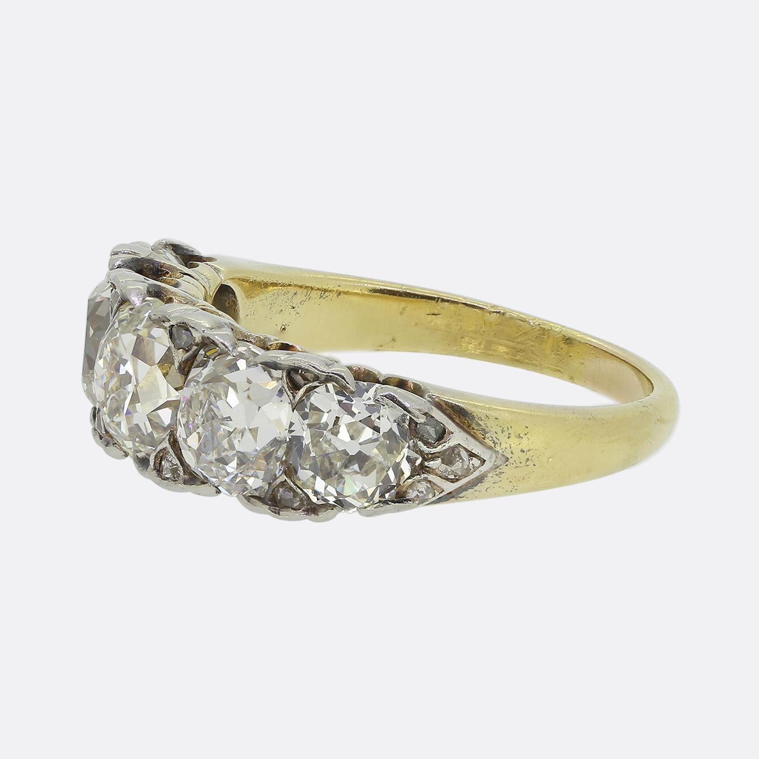 Here we have an exceptional five-stone diamond ring. This antique piece was crafted during the later stages of the Victorian period and features five round faceted old mine cut diamonds, each set in platinum to accentuate their white radiance. The