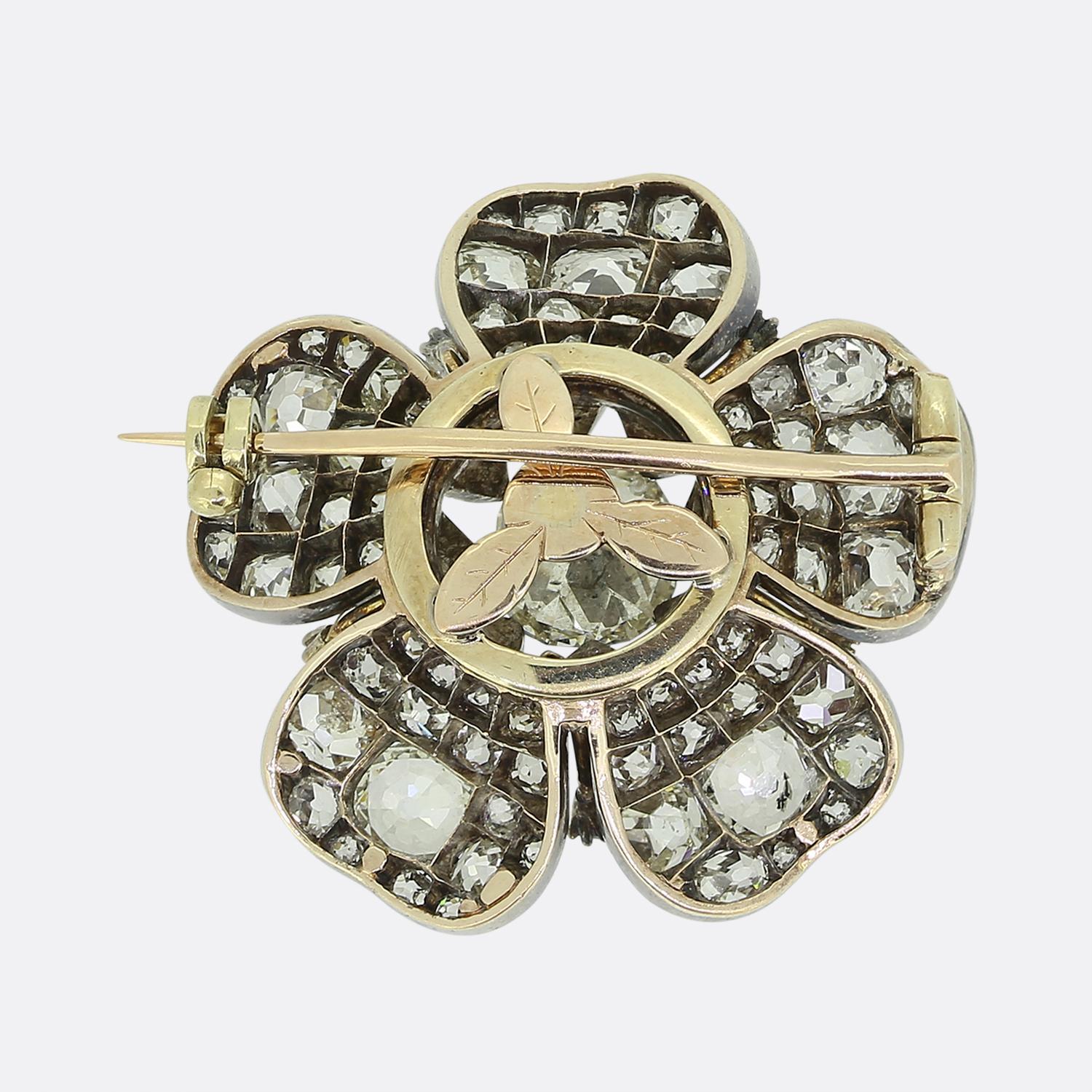 Here we have a gorgeous brooch taken from the Victorian period. This piece has been expertly hand-crafted from 18ct yellow gold into the shape of a flower head. Taking centre stage is 1.50ct old cushion cut diamond which is surrounded by five