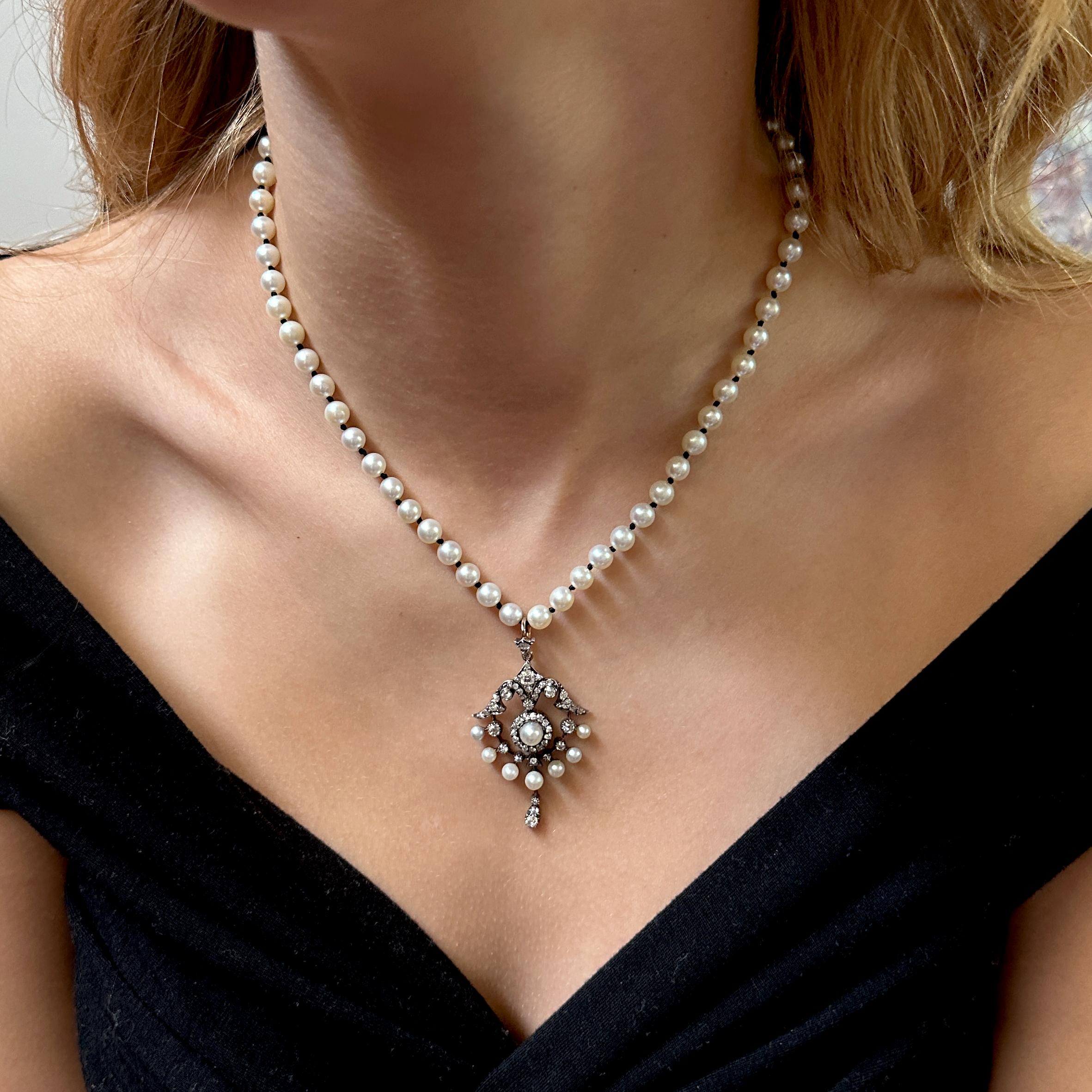 We acquired this extraordinary pendant from an antique jewelry dealer in New Zealand.  

Sort of a hybrid between a garland and a wreath, it boasts at least 1.7 carats in old cut diamonds plus eight pearls, all meticulously set from its hinged bale
