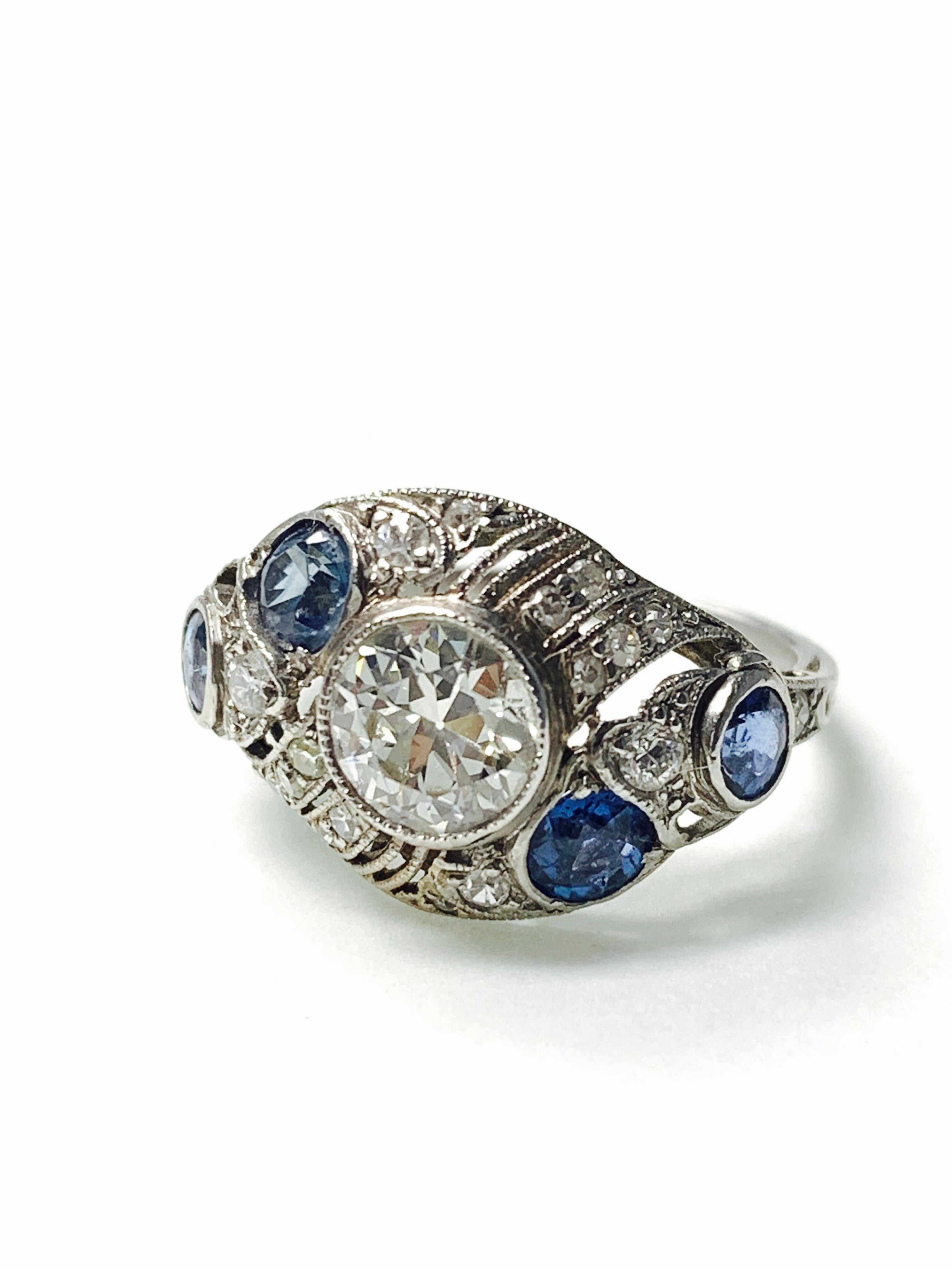 Antique old European cut diamond and blue sapphire ring handcrafted in platinum. 
The details are as follows : 
Diamond weight : 0.80 carat ( center ) ( H VS1) 
Diamond weight : 0.20 carat ( small diamonds ) ( HVS1 ) 
Blue sapphire weight : 0.60