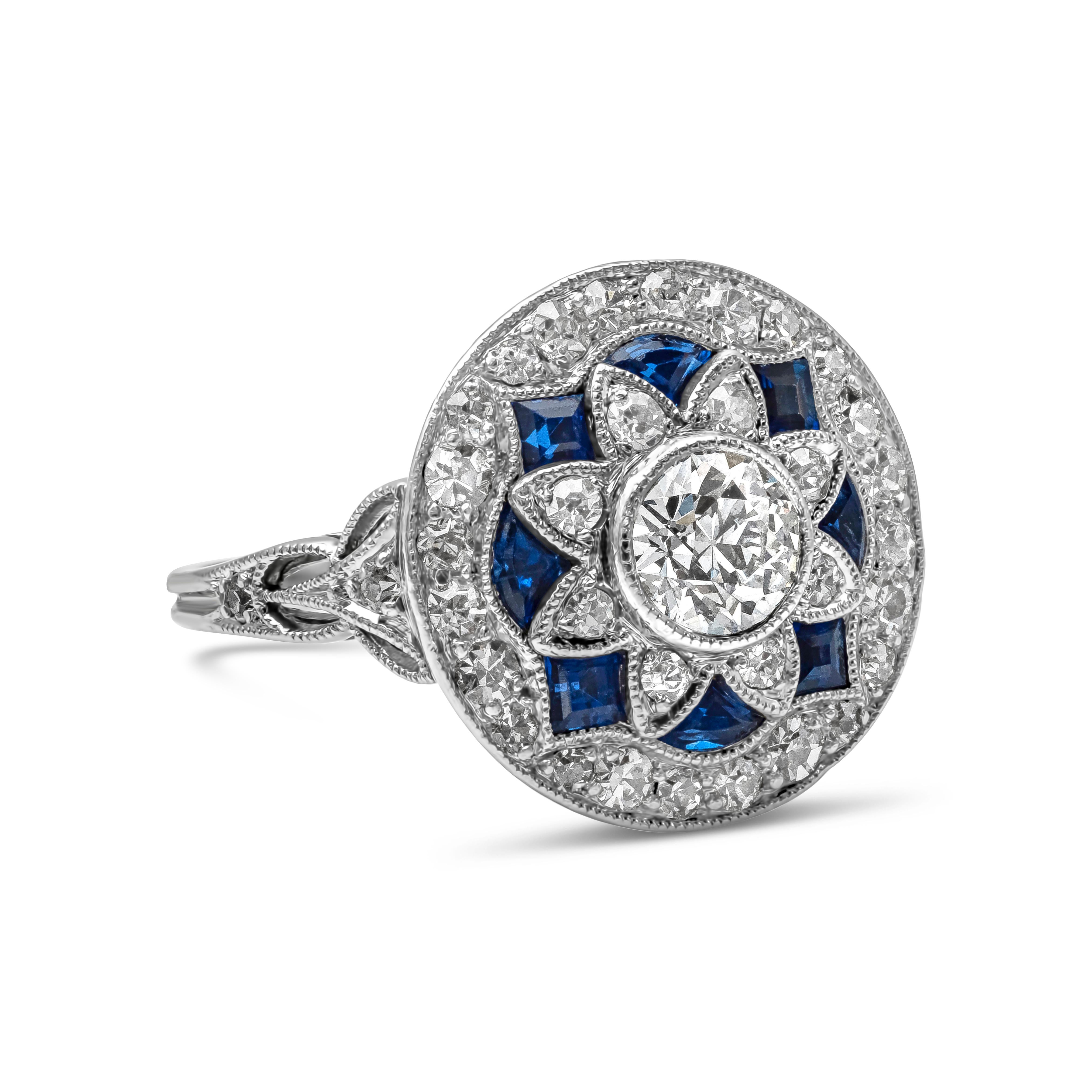 Showcasing a 0.45 carat old European cut diamond, set in an antique and intricately-designed mounting accented by sapphire and diamonds. Accent sapphires weigh 0.32 carats total; diamonds weigh 0.35 carats total. Made in platinum.