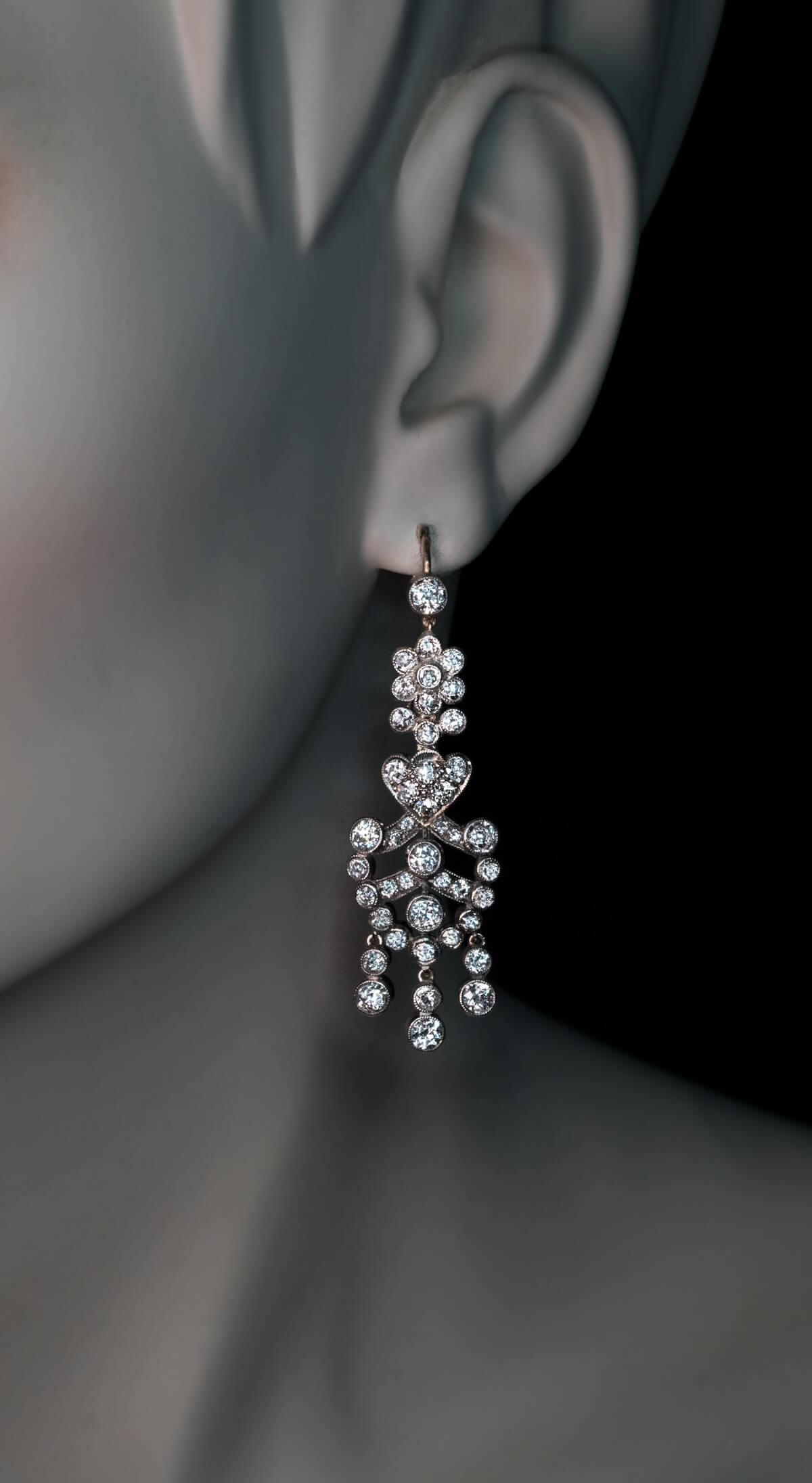 Circa 1900

These Belle Epoque dangle earrings are crafted in silver-topped 14K gold (front – silver, back – gold). The earrings are bezel-set with sparkling Old European cut diamonds of various sizes (G-H-I color, mostly VS2-SI1