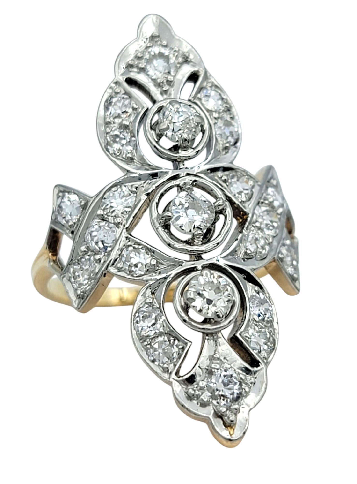 Ring Size: 7.5

Exuding vintage charm and elegance, this antique navette ring is a breathtaking testament to timeless craftsmanship. Crafted in 14 karat yellow and white gold, this elongated marquise-shaped design is adorned with a dazzling array of