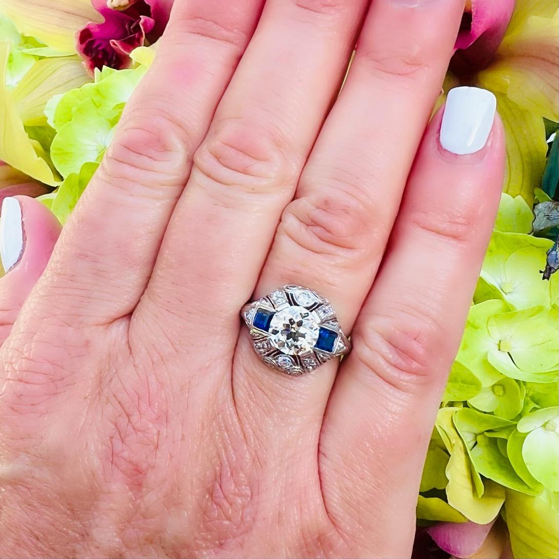 Own a stunning piece of history! This antique platinum ring circa early 1900's features a phenomenal Old European Cut Diamond at it's center, weighing approximately 1.50 carats. The stone (and entire ring!) are in fantastic condition, and the
