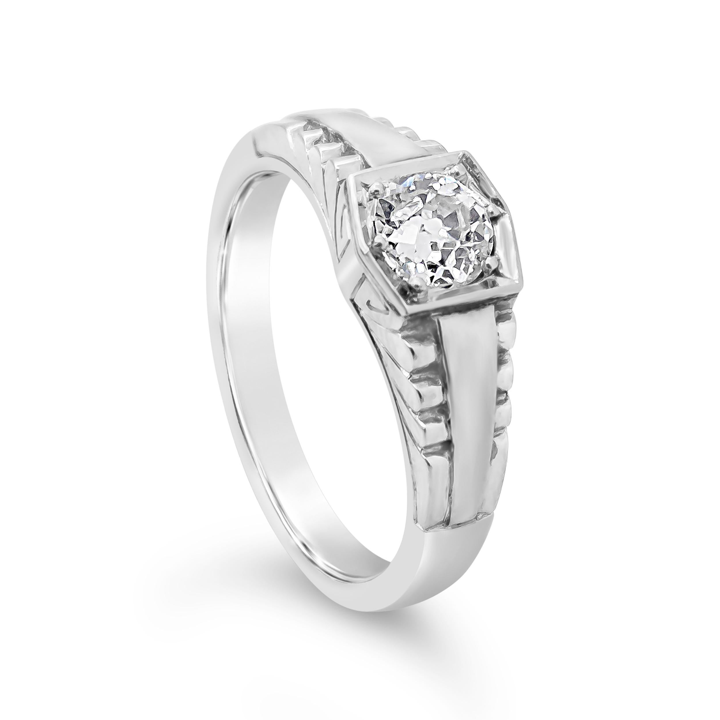 A unisex antique style band showcasing a 0.59 carats old mine cut diamond, secured with six prongs, in a unique setting. Diamond is approximately G color, VS2 clarity. Made in 18k white gold. Size 8 US resizable upon request. 



