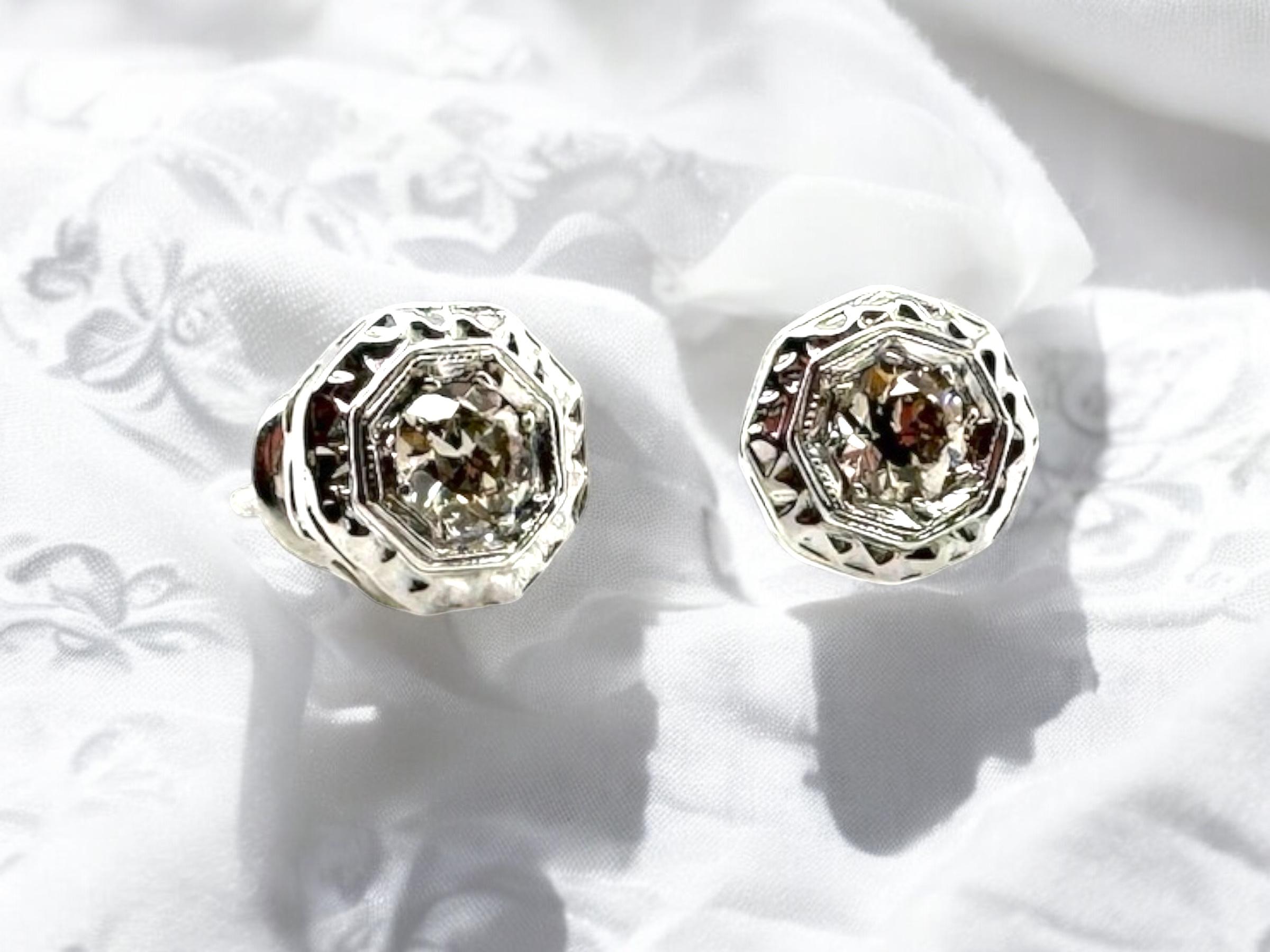 We always love vintage earrings!
These beauties are perfect for any age or occasion. 

Earring Details
Material: 14K White Gold Setting; 10K White Gold Screw Backs
Era: Art Deco 1920 - 1940
Stud Width: 7.8mm
Weight: 1.6 Grams

Accented by the