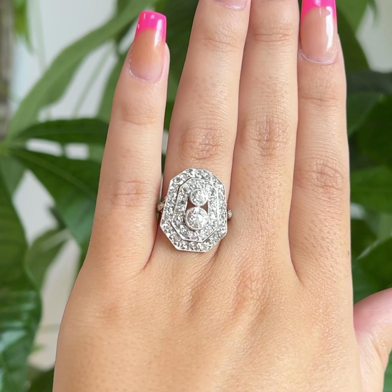One Antique Old European Cut Diamond White Gold Double Halo Ring. Featuring one old European cut diamond of approximately 0.45 carat, and one old European cut diamond of approximately 0.20 carat, both graded G color, SI clarity. Accented by 12 old