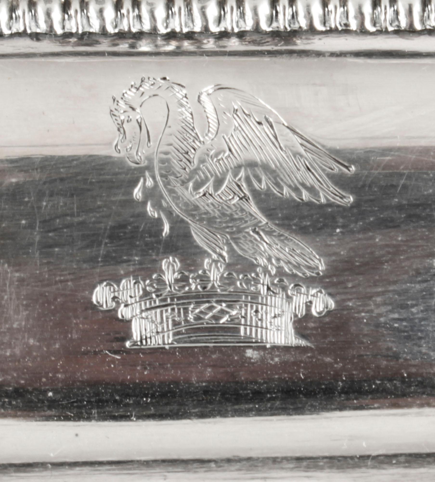 This is a superb antique George III Old Sheffield silver plated butter dish, circa 1820 in date.
 
The dish is modelled as a miniature entree dish, with gadrooned borders, reeded handles and four paw feet. It has a decorative engraved crest to lid