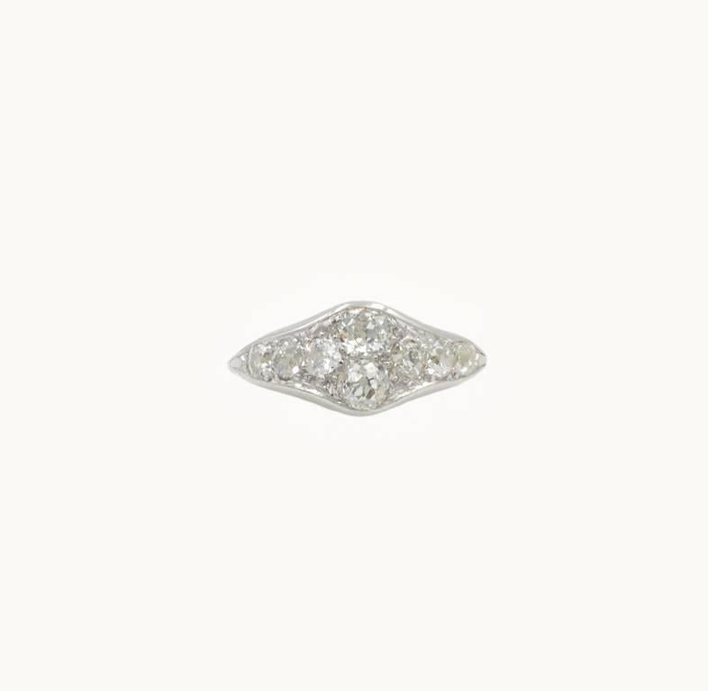 Antique Old Mine Cut eight diamond cluster ring in platinum from circa 1910.  This ring features two Old Mine Cuts diamonds that are each approximately 0.30 carats along with an additional six Old Mine Cut diamonds that are each approximately 0.12