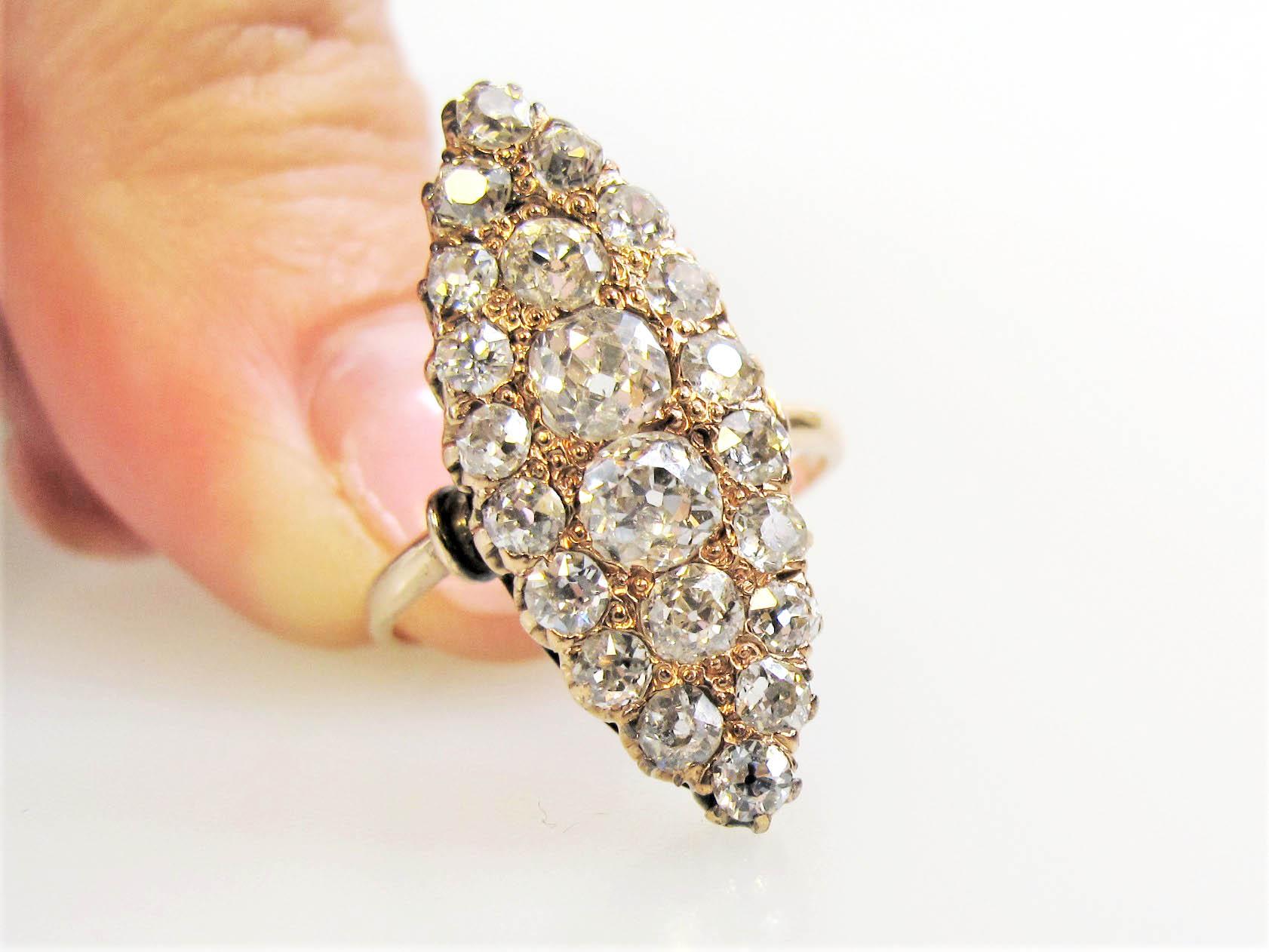 Ring size: 5.5

This stunning marquis shaped vintage diamond ring is the essence of old world elegance. The delicate rose gold shank paired with the incredible Old Mine Cut stones make for a breathtaking, ultra feminine piece that you will treasure