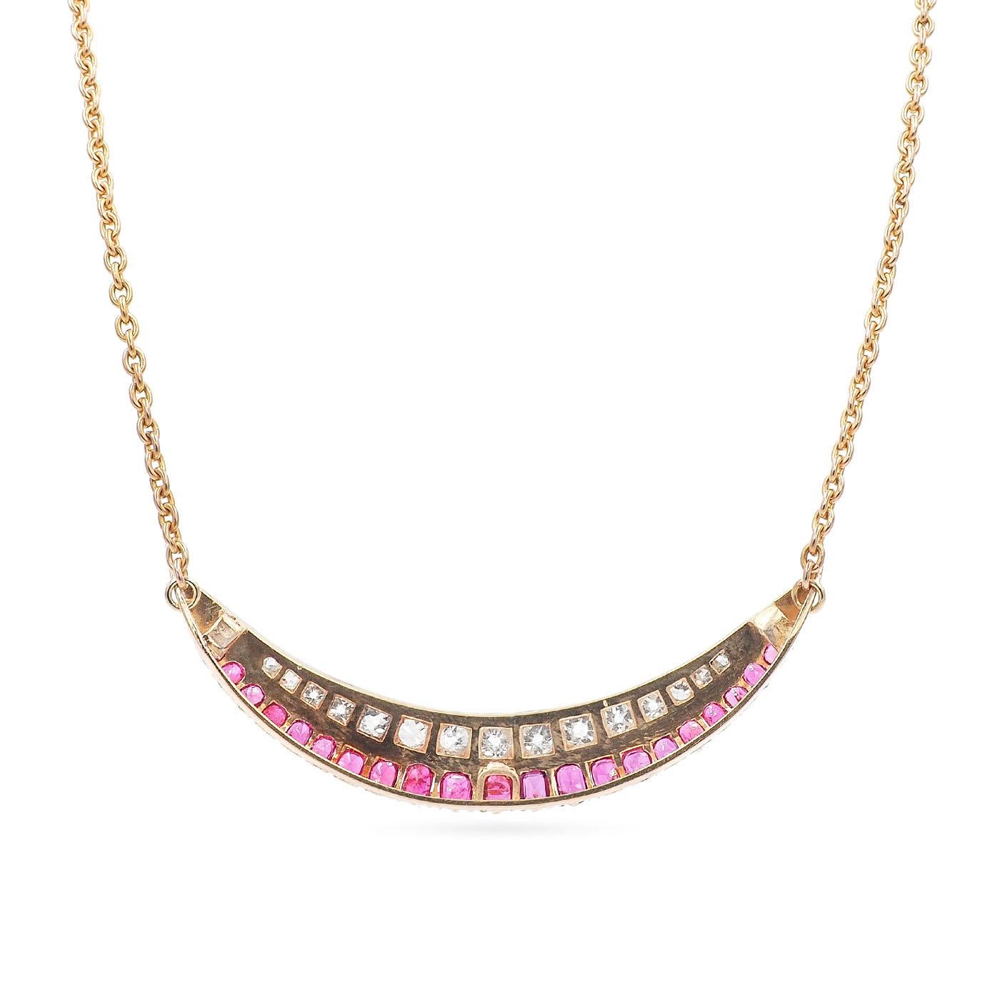 Edwardian era Crescent Moon Necklace composed of 18k yellow gold and platinum. Set with 15 bright & white Old Mine Cut diamonds weighing approximately 3.00 carats in total and 21 Natural Unheated Rubies weighing approximately 3.70 carats in total.