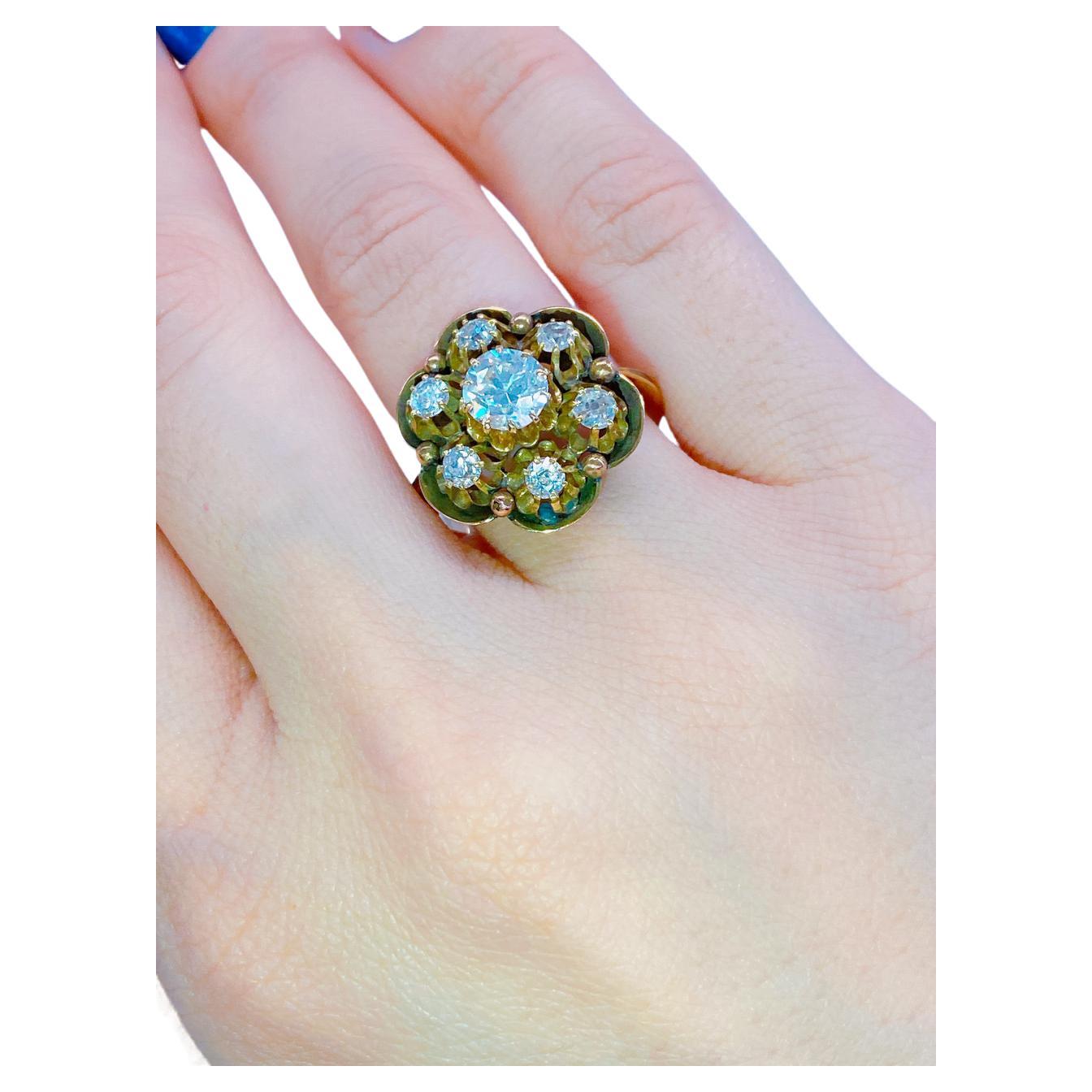 Antique Russian old mine cut diamond ring made by important faberge workmaster August Holmstrom in floral design with an estimate total diamond weight of 1.80 carat centered stone is 0.80ct flanked with smaller diamonds 0.12ct each white colour
