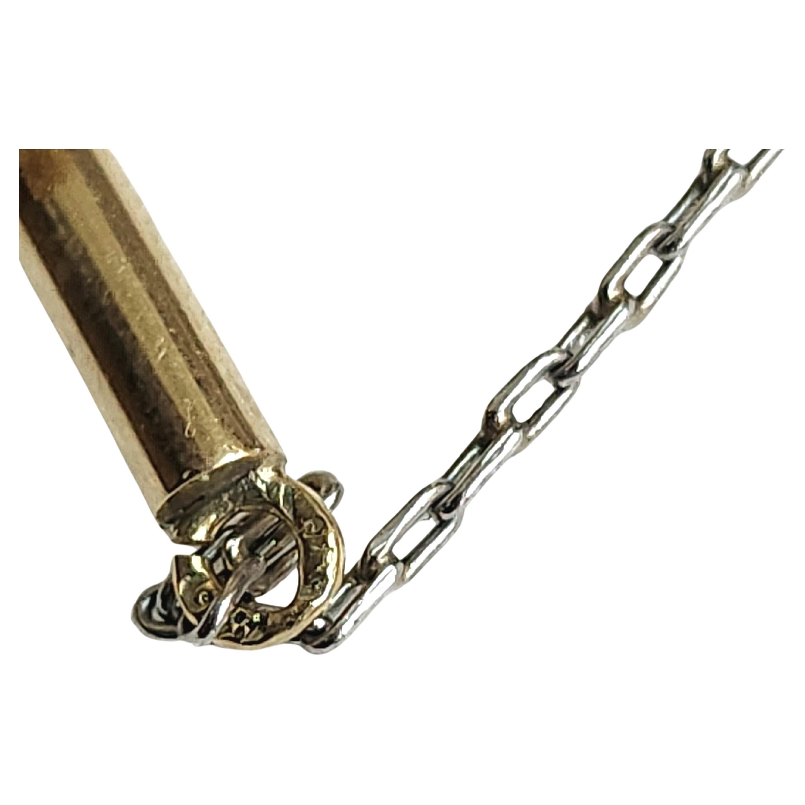 Antique 14k gold movable pendant with estimate diamond weight 0.50 carats attached with a platinume chain and 14k gold lock hall marked 56 imperial russian gold standard ( pendant lenght 4cm and chain lenght 50cm) 