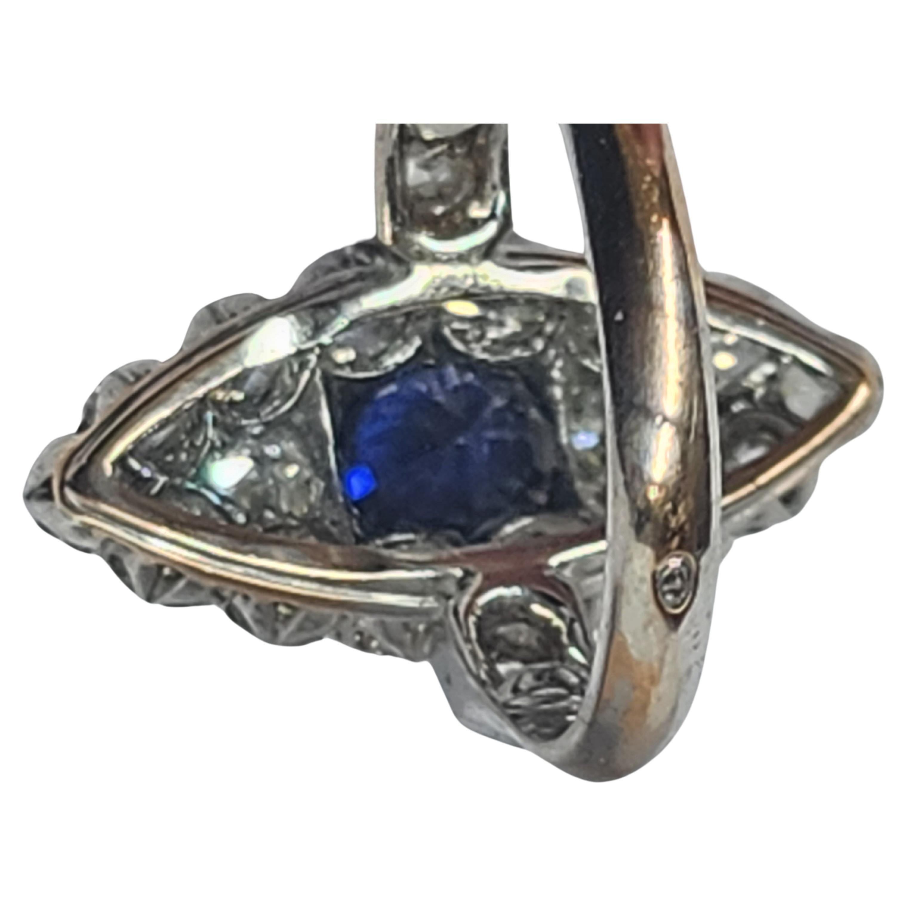 Antique old mine cut diamond ring with an estimate weight of 1.5 carats H/I color excellent cut and spark centered with blue sapphire stone ring is hall marked with french owl import mark for 18k gold 1902s ring head diameter 20mm 
