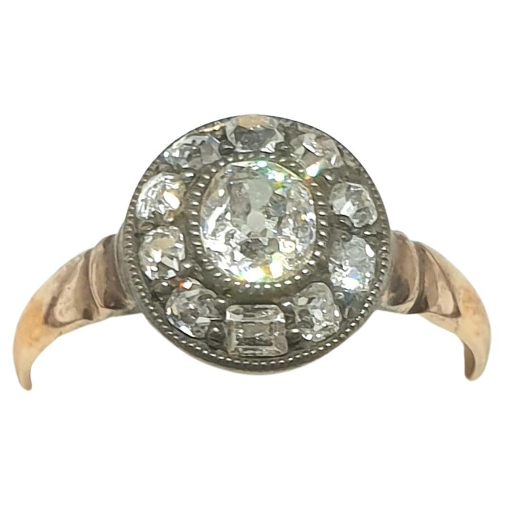 Antique old mine cut diamond solitaire 14k gold ring centered with 1 old mine cut diamond with an estimate weight of 0.50 carats diameter 5.50mm H color white flanked with smaller old mine cut diamonds estimate weight of 0.40 carats and ring head