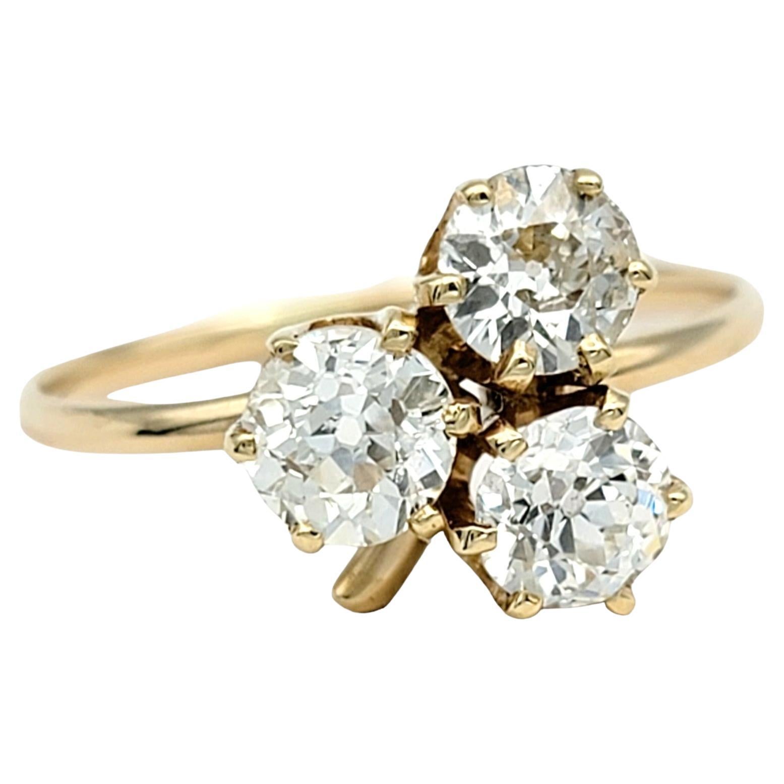 Ring Size: 5.5

Step back in time with this exquisite antique ring featuring a captivating trio of Old Mine Cut diamonds set in a charming clover motif. Crafted in luxurious 14 karat yellow gold, this piece exudes old-world charm and
