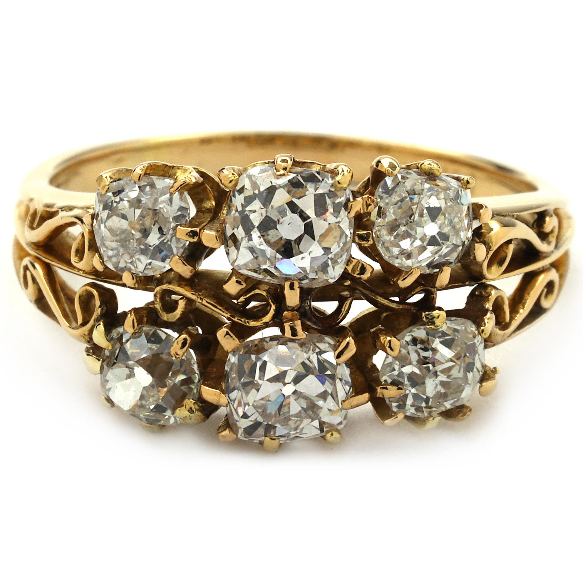 This antique ring is made of 14K yellow gold. It contains 6 old mine cut diamonds weighing 2.09 CTTW. The Color ranges G-I and Clarity is SI