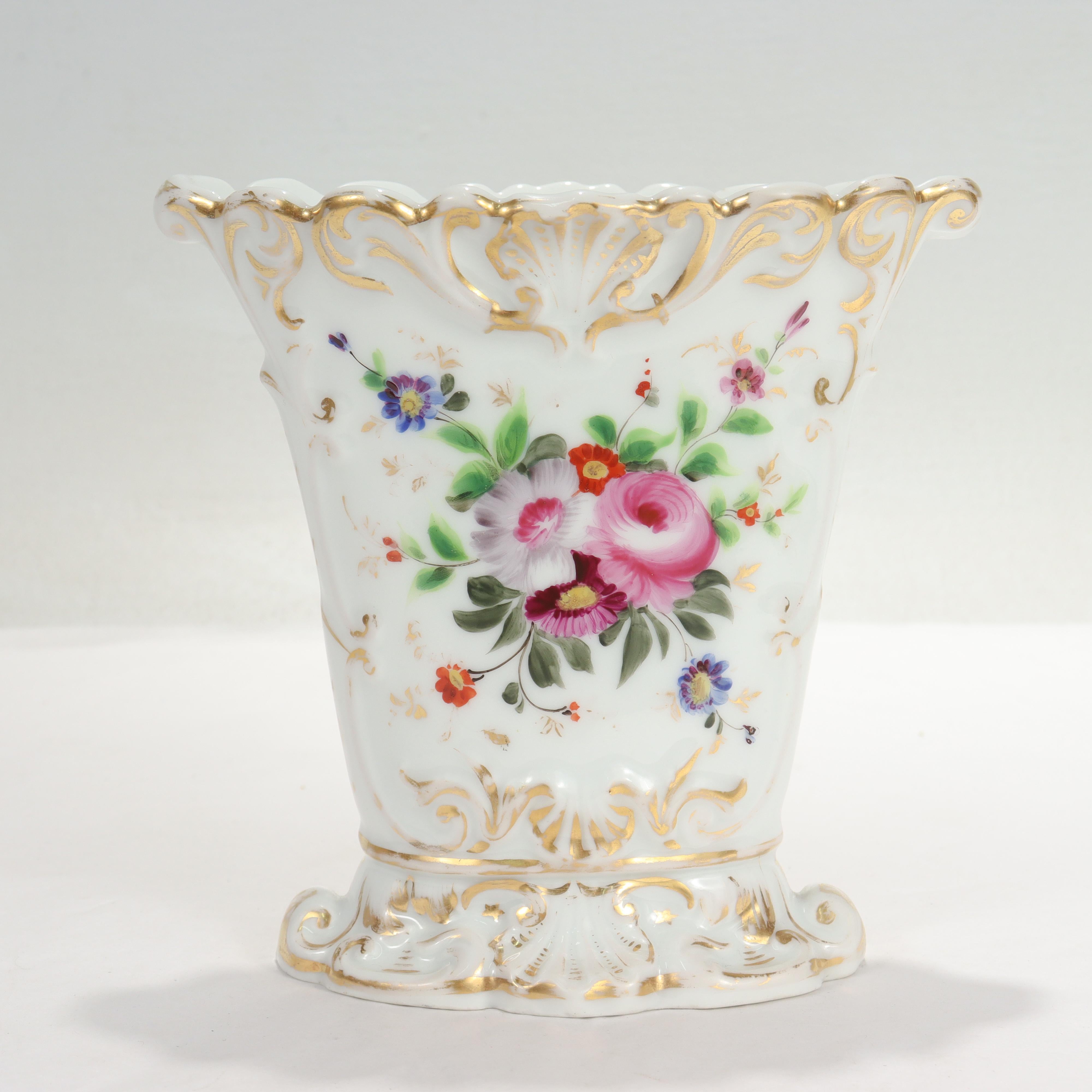A fine antique French porcelain vase.

With extensive gilding and painted floral decoration to each side.

Simply a great piece of Old Paris porcelain!

Date:
19th Century

Overall Condition:
It is in overall good, as-pictured, used estate