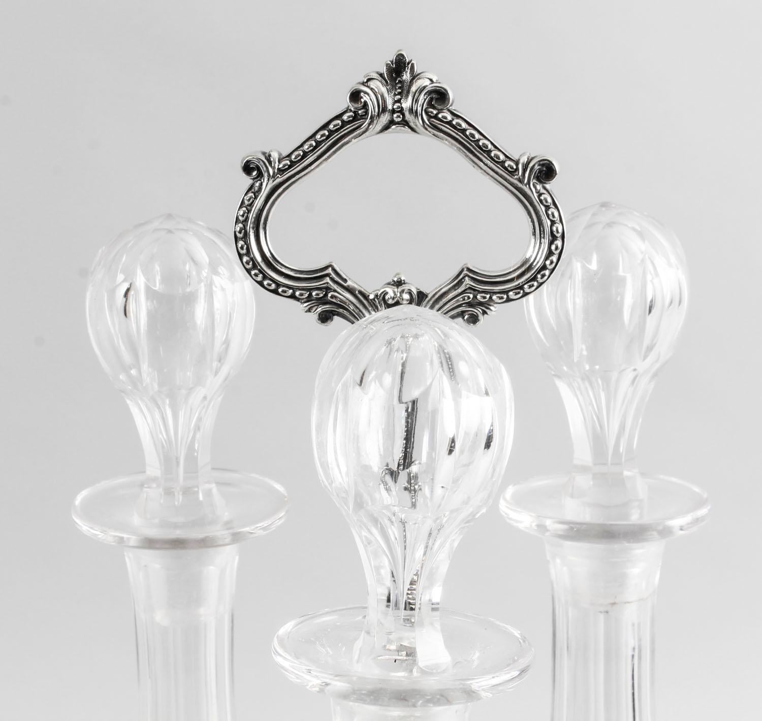 Good quality Elkington plate three bottle tantalus.

This is an attractive Old Sheffield silver plated tantalus stand with three Bohemian decanters with stoppers, in the classic English style and circa 1840 in date.

The silver plated decanter