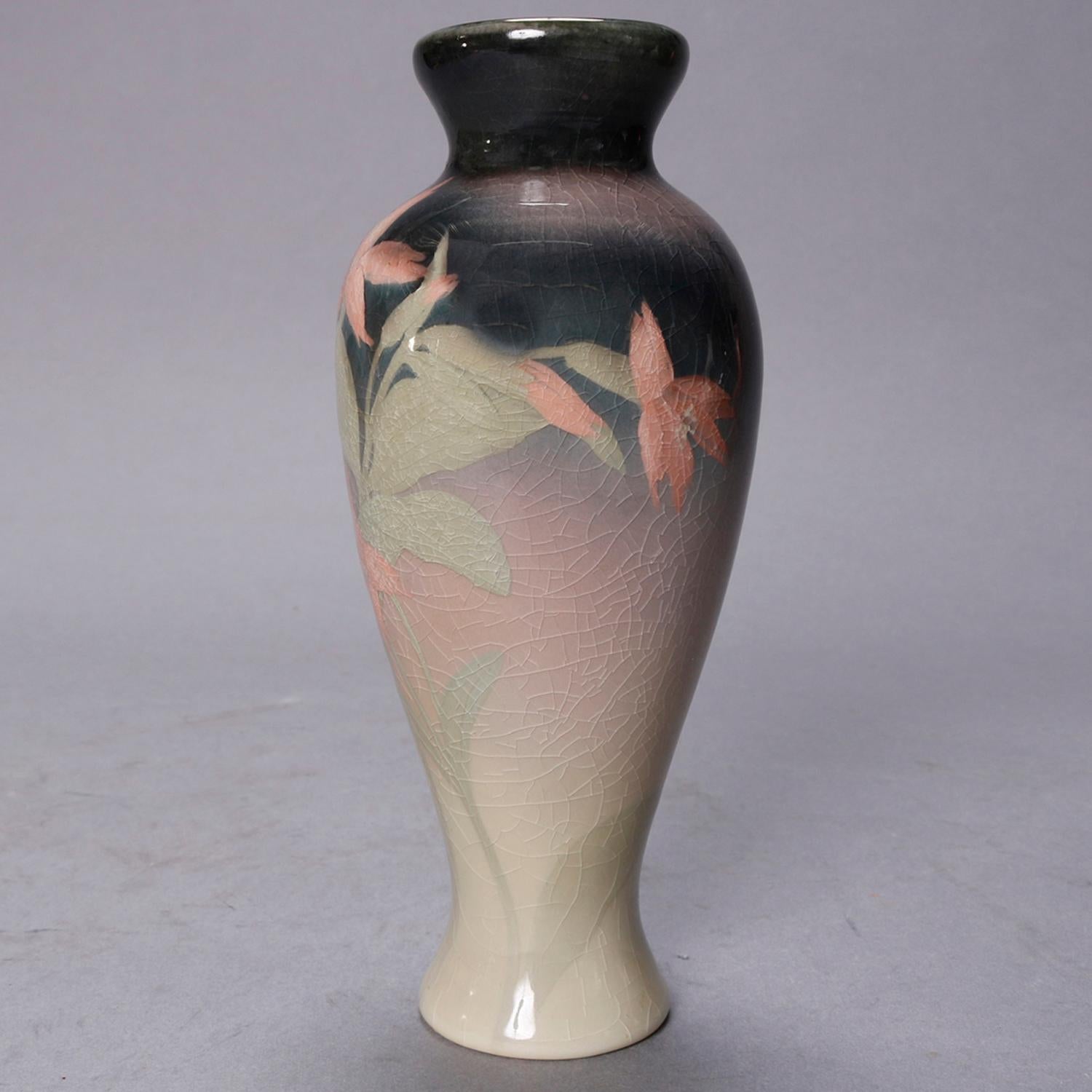 An artist signed art pottery vase by Olga Geneva Reed for Rookwood offers ombre coloring with tiger lilies and iris glaze, maker mark and artist initialed on base, 19th century. 

Measures - 7.25