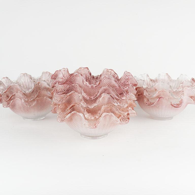 A set of 11 pink scalloped glass candy dishes or ice cream bowls. With round bottoms and ombré pink sides, this lovely set of dishes will bring a pop of color to any place setting. 

Specifications:
Each dish: 221 grams
5.2 lbs total
6