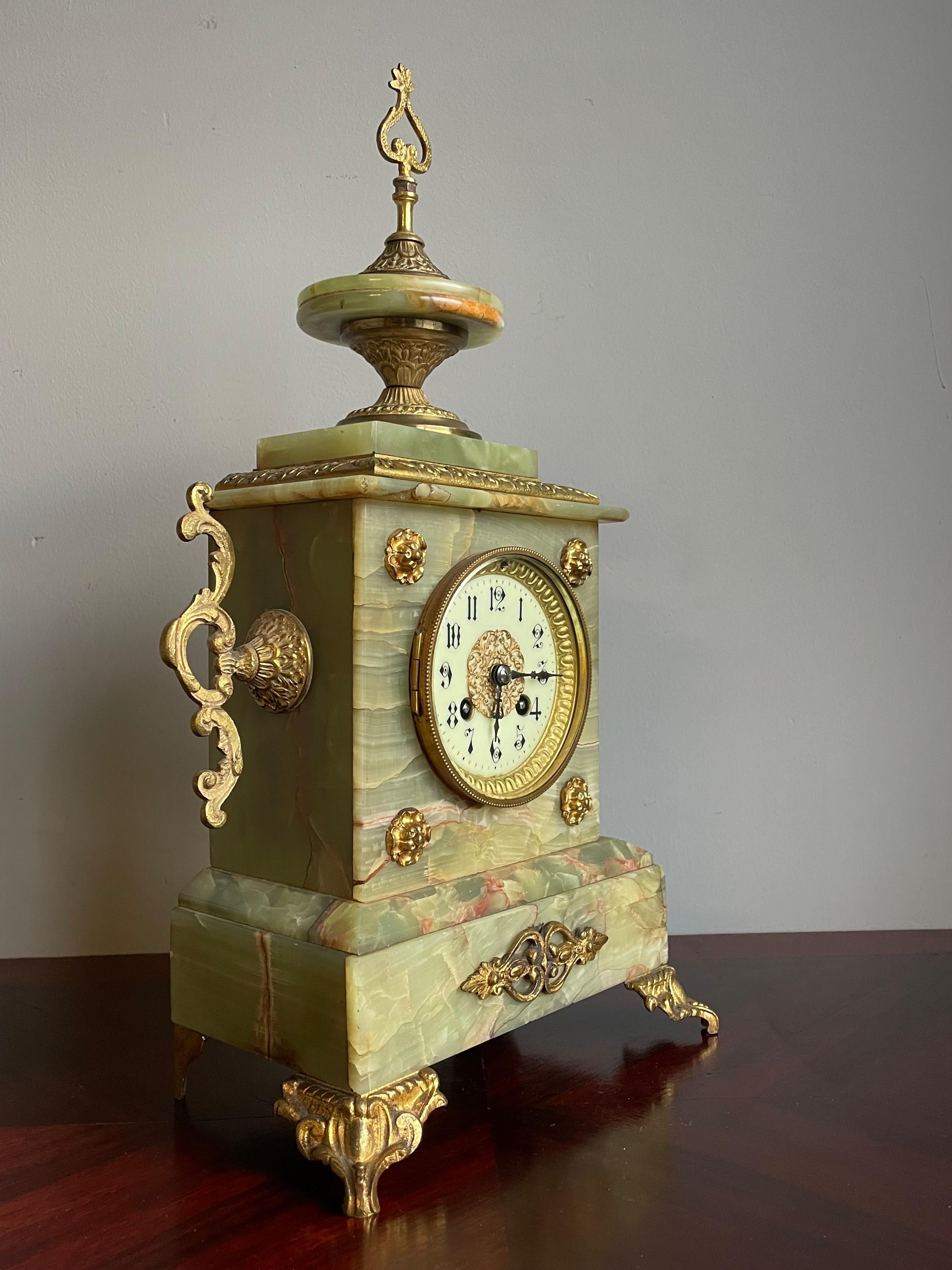 Great colors & wonderful design antique clock from the early 1900s.

Just from looking at the stunning design, multiple quality materials and amazing details one can see that this remarkable antique clock could only have been hand-crafted by a