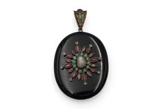 Antique onyx locket with pearls, garnets, and turquoises.
