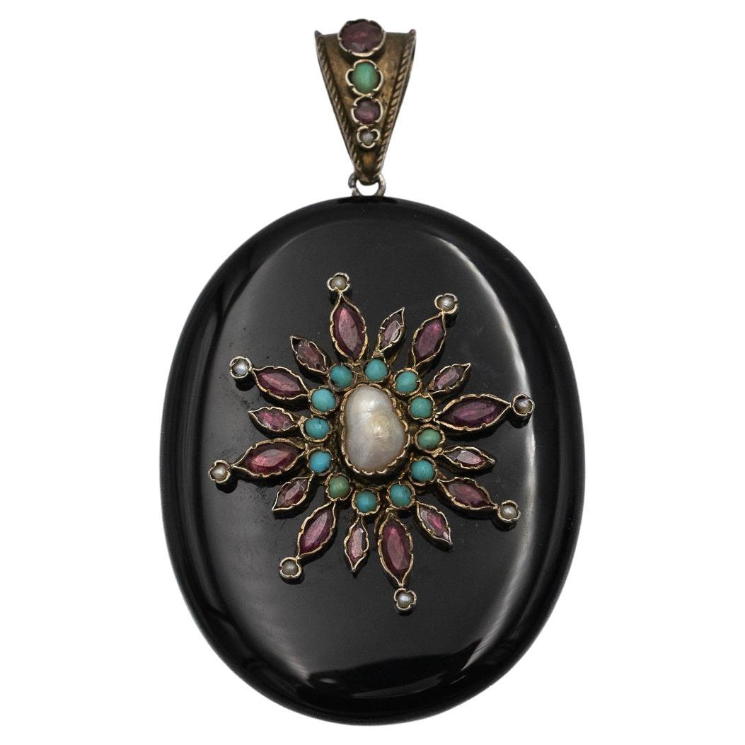 Antique onyx locket with pearls, garnets, and turquoises. For Sale