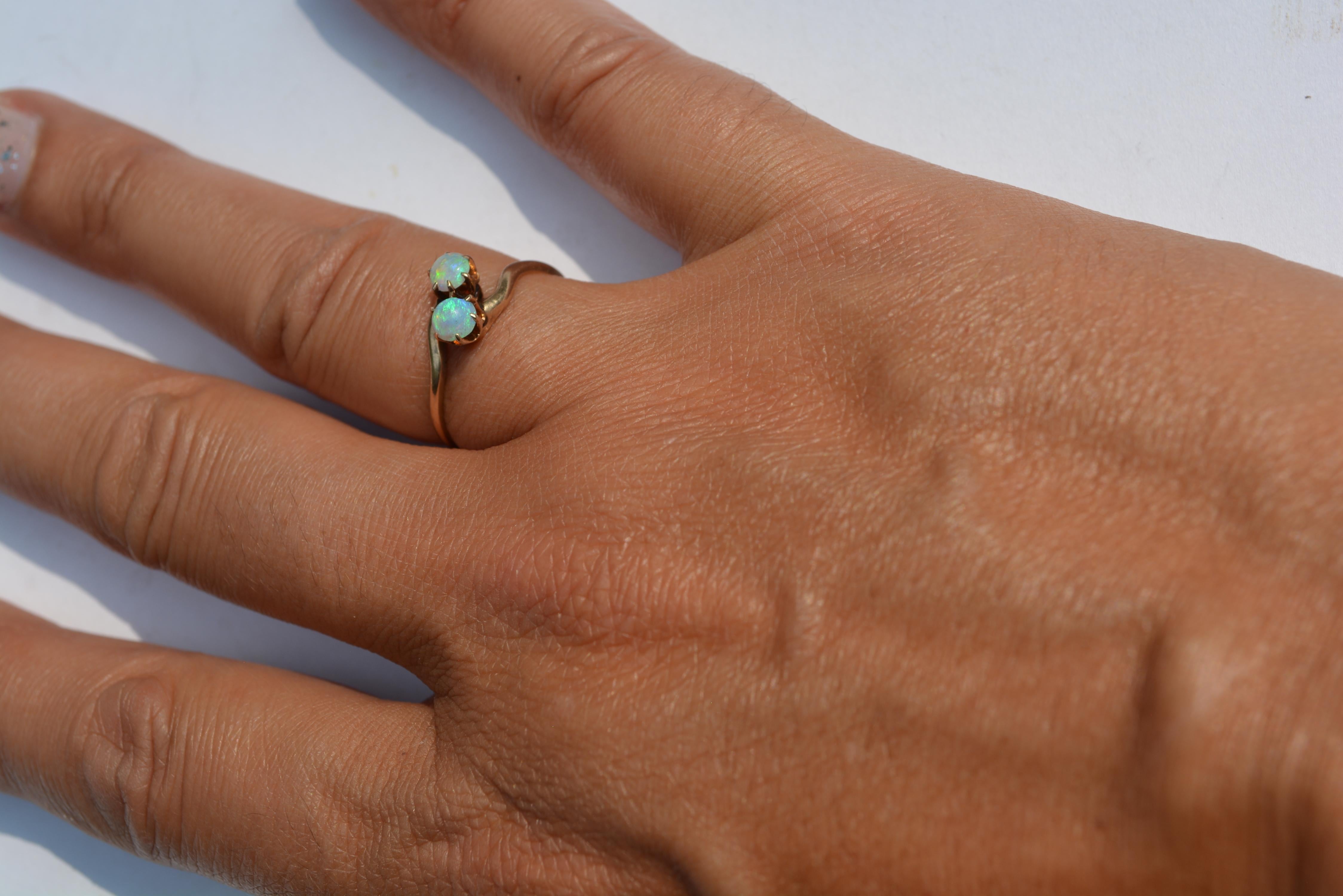 Victorian opal 14k gold ring, old mark.  Lovely prong design and quality opals. Size 7 3/4. 
