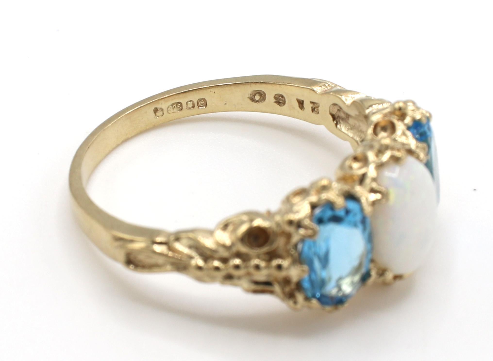 opal and blue topaz ring