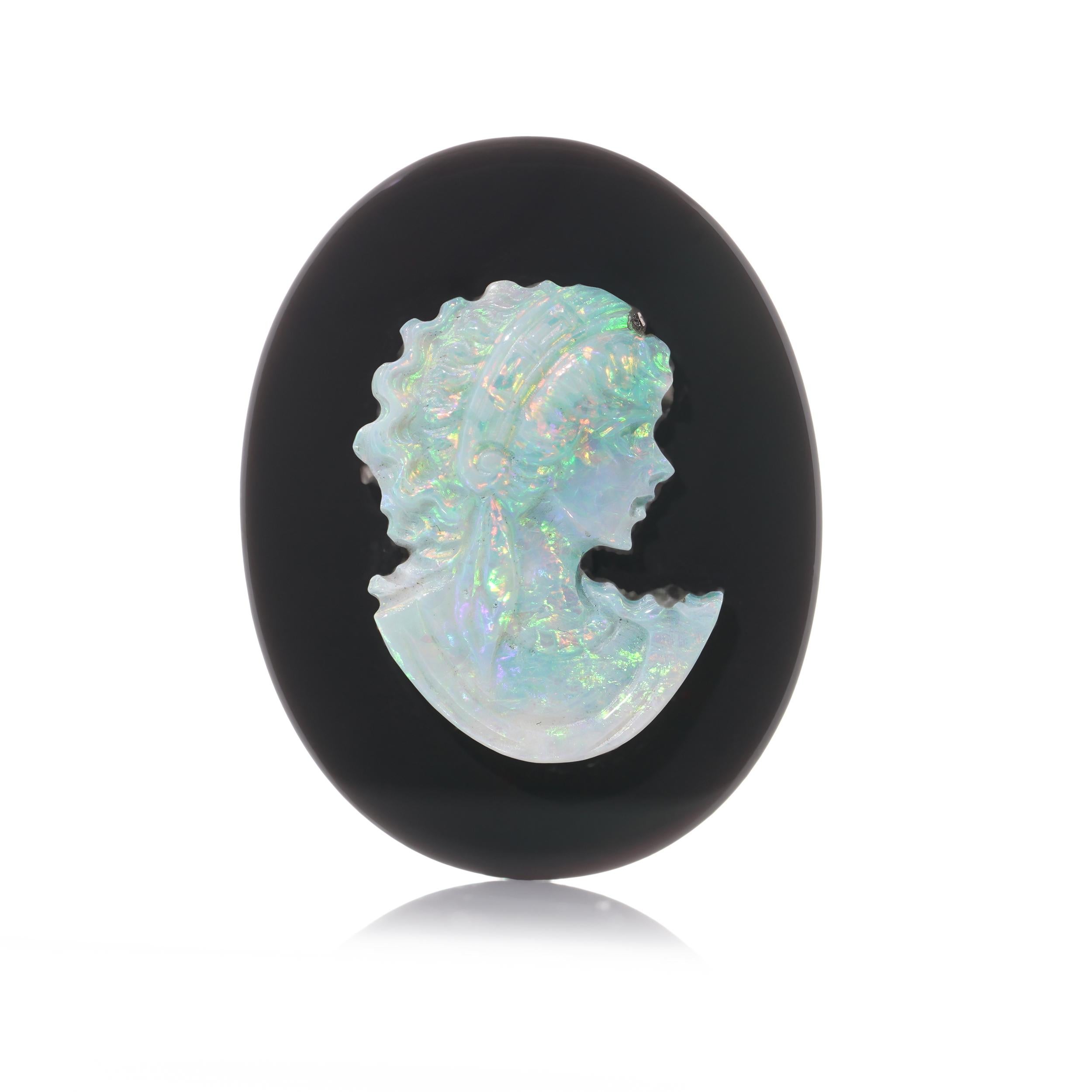 Oval Cut Antique opal carving cameo mounted on the onyx plaque.  For Sale