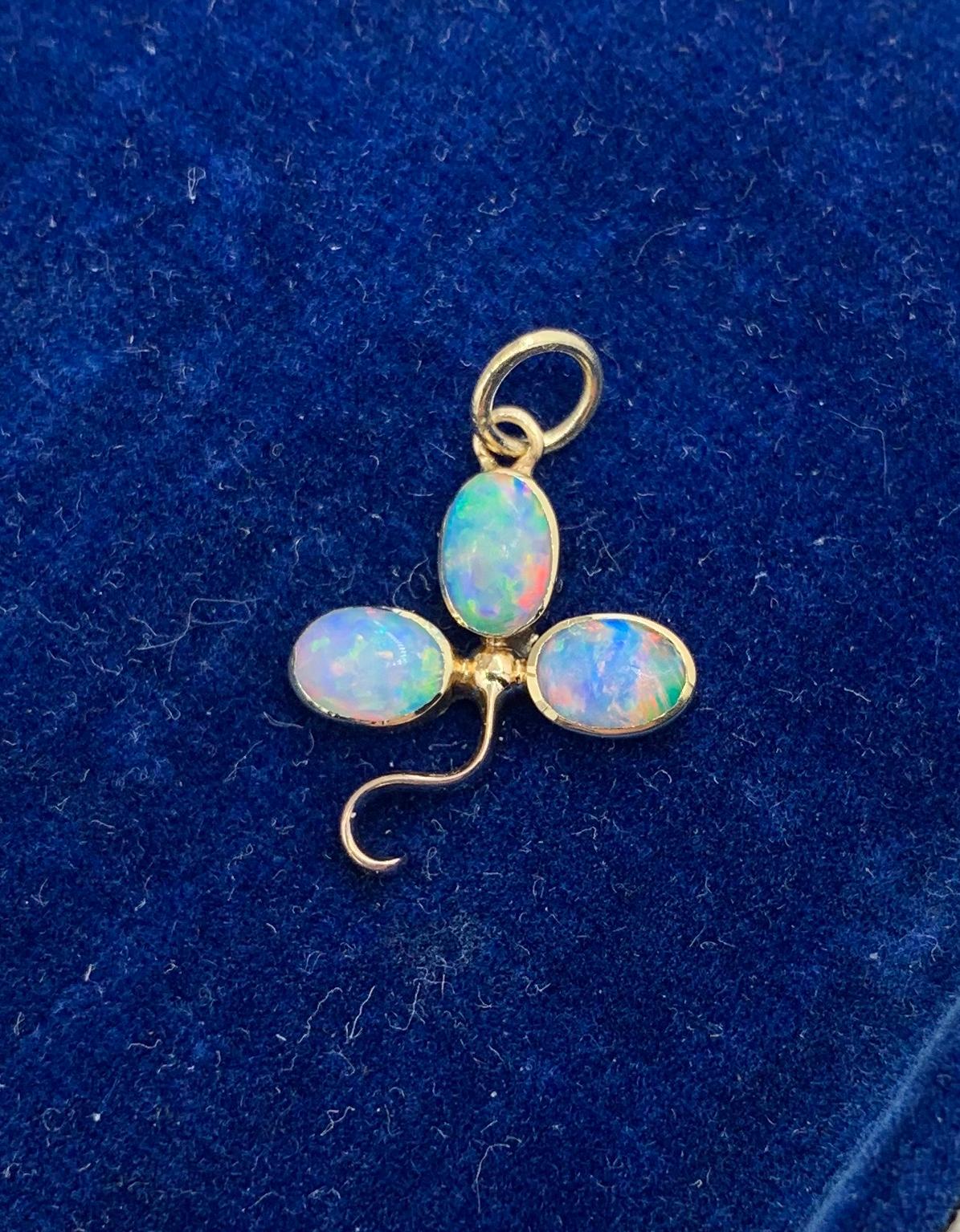 THIS IS A ROMANTIC OPAL FLOWER CLOVER SHAMROCK JEWEL FOR GOOD LUCK!  THE STUNNING PENDANT HAS THE MOST GORGEOUS NATURAL OVAL  CABOCHON OPALS WITH BLUE, GREEN, YELLOW AND ORANGE FIRE SET IN 9K ROSE GOLD IN THIS FLOWER SHAMROCK CLOVER MOTIF PENDANT.  