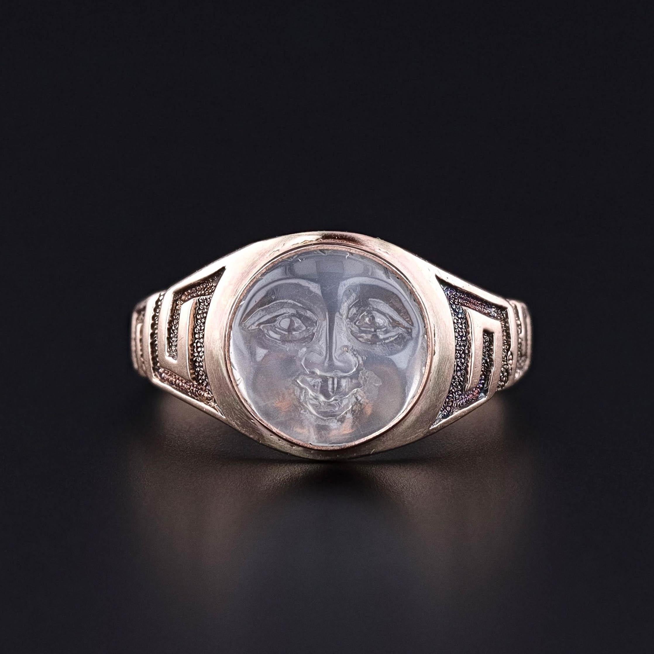 Antique Man in the Moon Ring: This ring features a man in the moon of molded, opalescent glass set in 8k gold. It was created from an antique stickpin (circa 1920) and an antique signet ring (circa 1900).

The face of the ring measures 0.45 inches