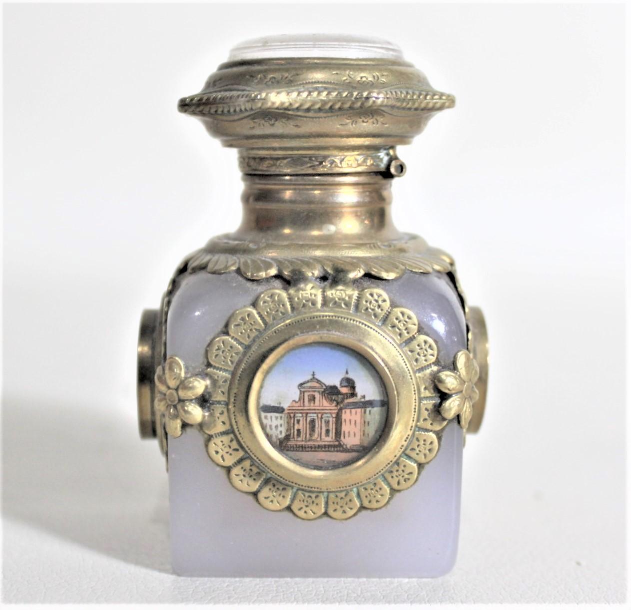 This antique opalescent perfume bottle is unsigned, but presumed to have been made in Europe, likely in France or Italy in circa 1890 for a Grand Tour in the period Victorian style1. This perfume bottle has decorative brass mounts on all four sides