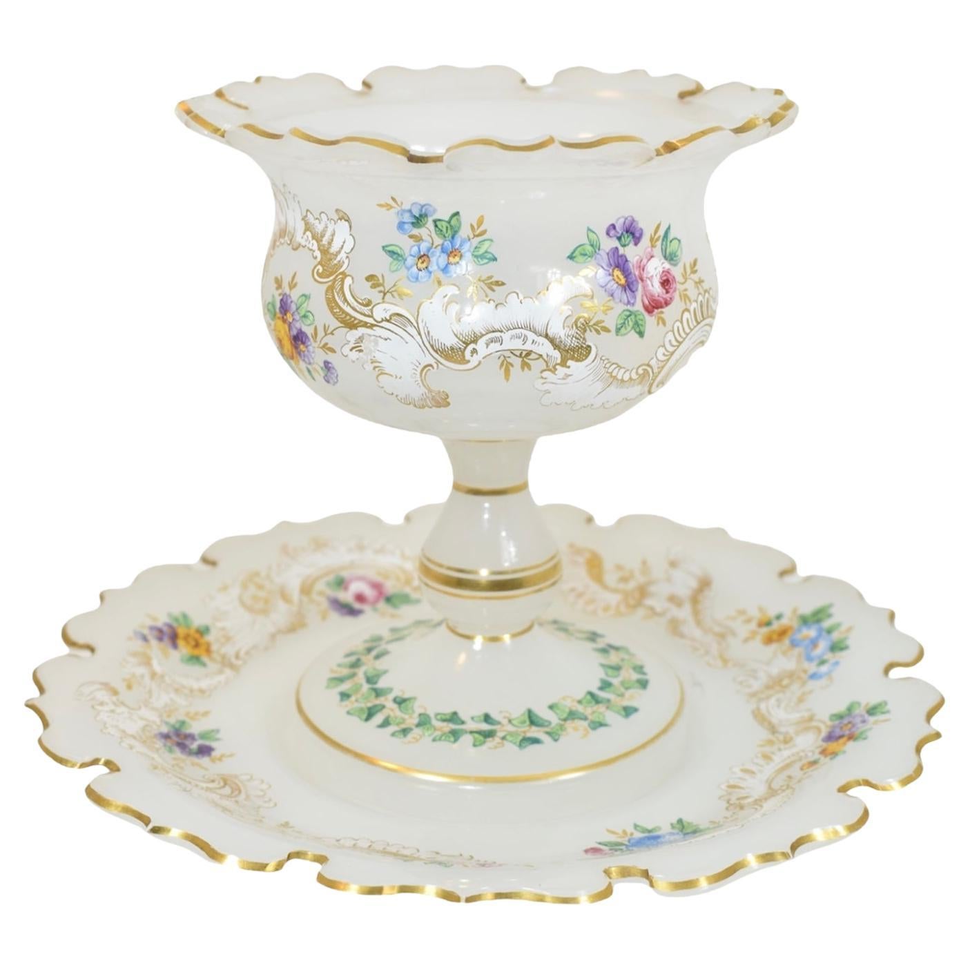 Exceptional 2-piece set, tazza bowl with its matching plate, opal glass

Fine quality of the 19th century glass manufacture

Profuse hand-painted with rich and impressive gilded enamel decoration forming scrollworks and bouquets

Beautifully