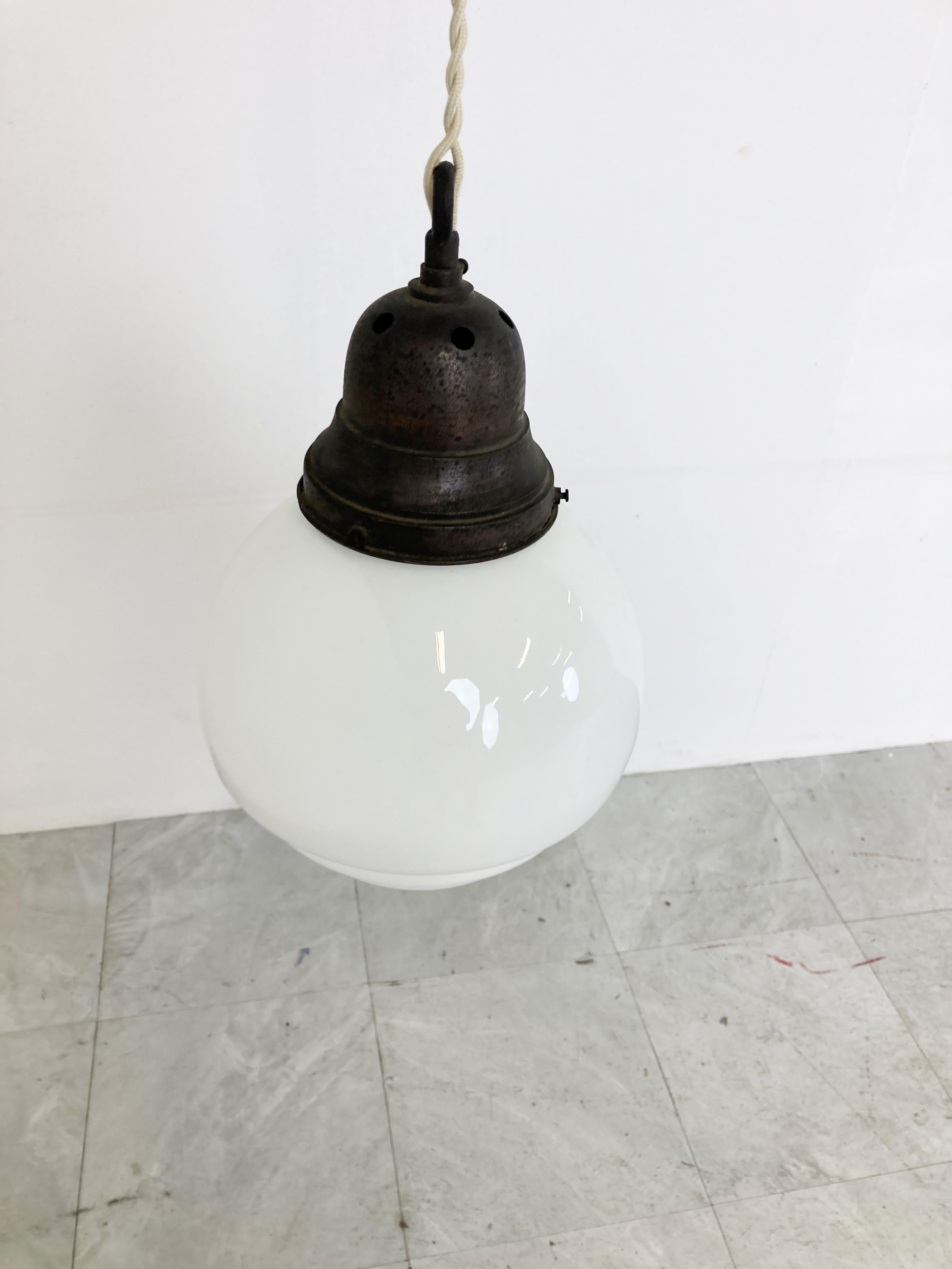 Antique stepped art deco hallway pendant light.

This lamp is very typical for the art deco era and were widely used to be hung in hallways, offices or larger public places.

The lamp has the original copper dome shaped hade holder.

The shade