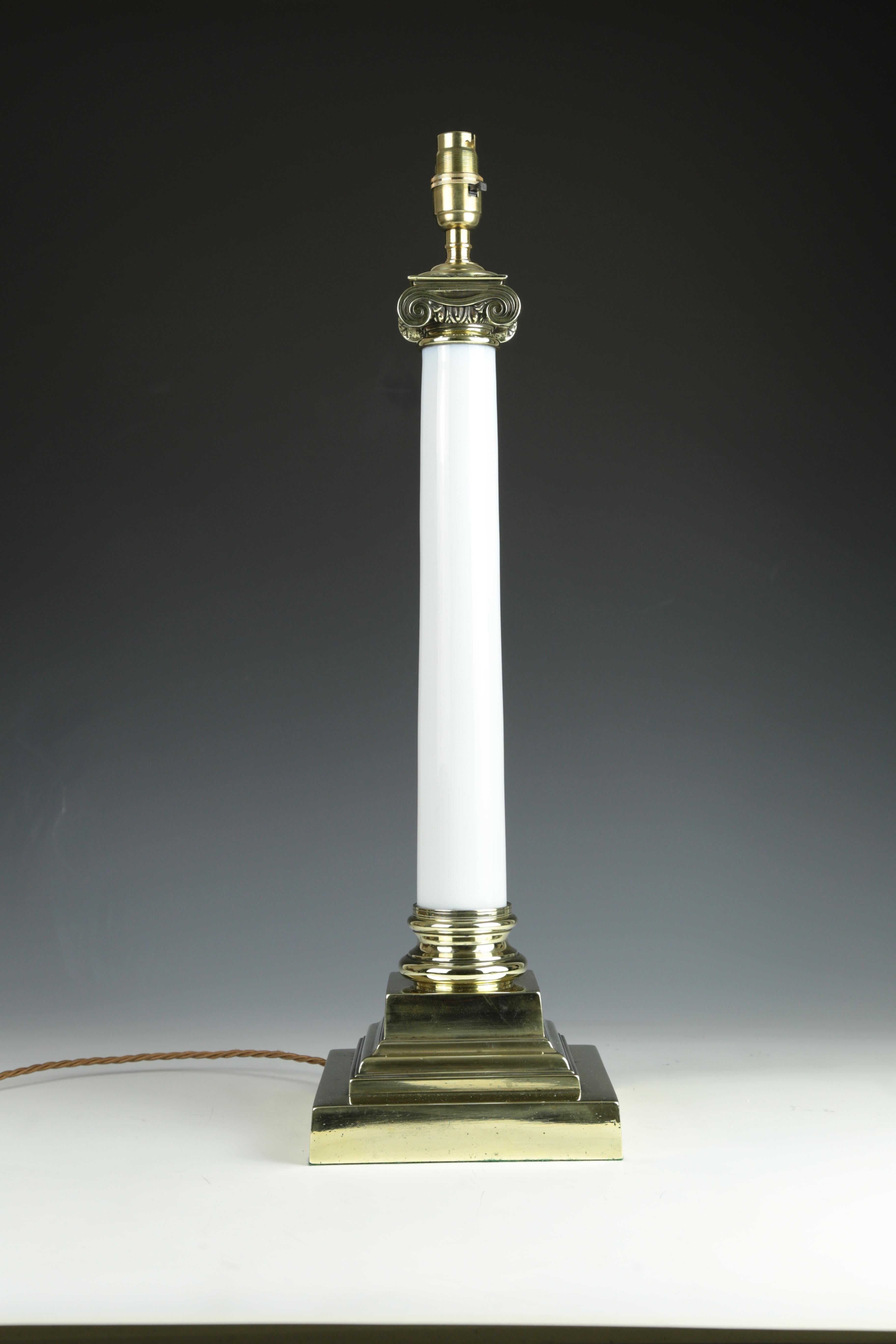 Antique Opaline White Ionic Column Table Lamp

This exquisite table lamp features an elegant white opaline column with intricate Ionic detailing, crowned by a magnificent Ionic top. The lamp stands on a classical stepped brass base, thoughtfully