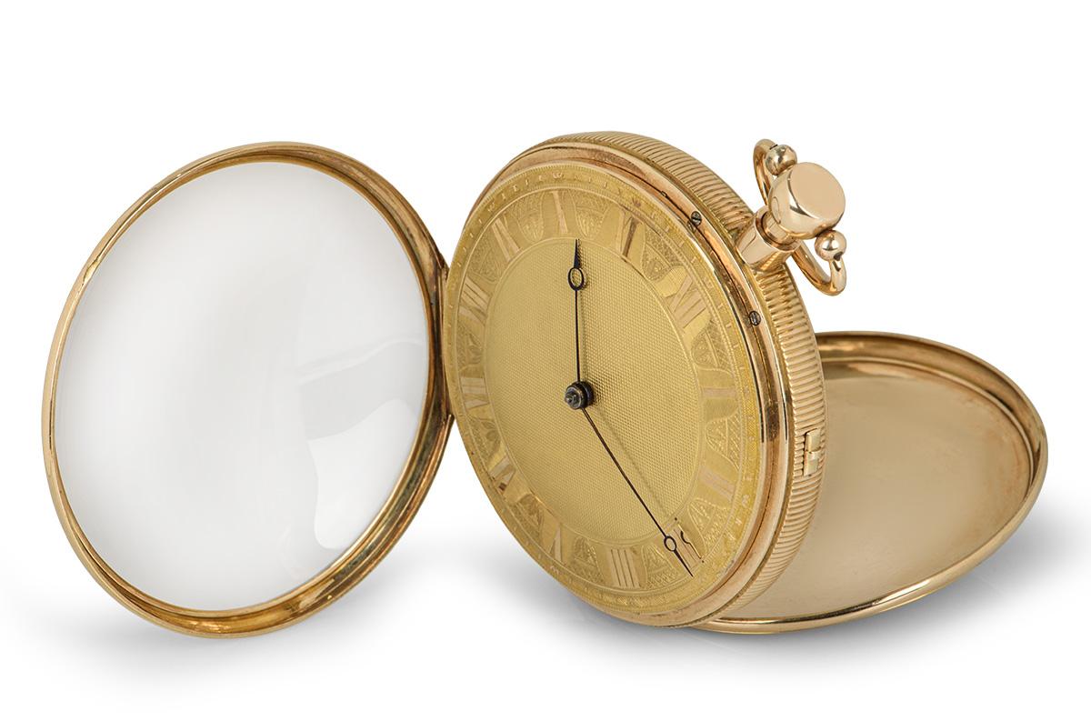 A antique 1820s 58 mm 18k Yellow Gold Open Face Musical Quarter Repeater Gents Pocket Watch, champagne dial with roman numerals, a fixed 18k yellow gold bezel, plastic glass, an 18k yellow gold hinged caseback, an 18k yellow gold inner cuvette case