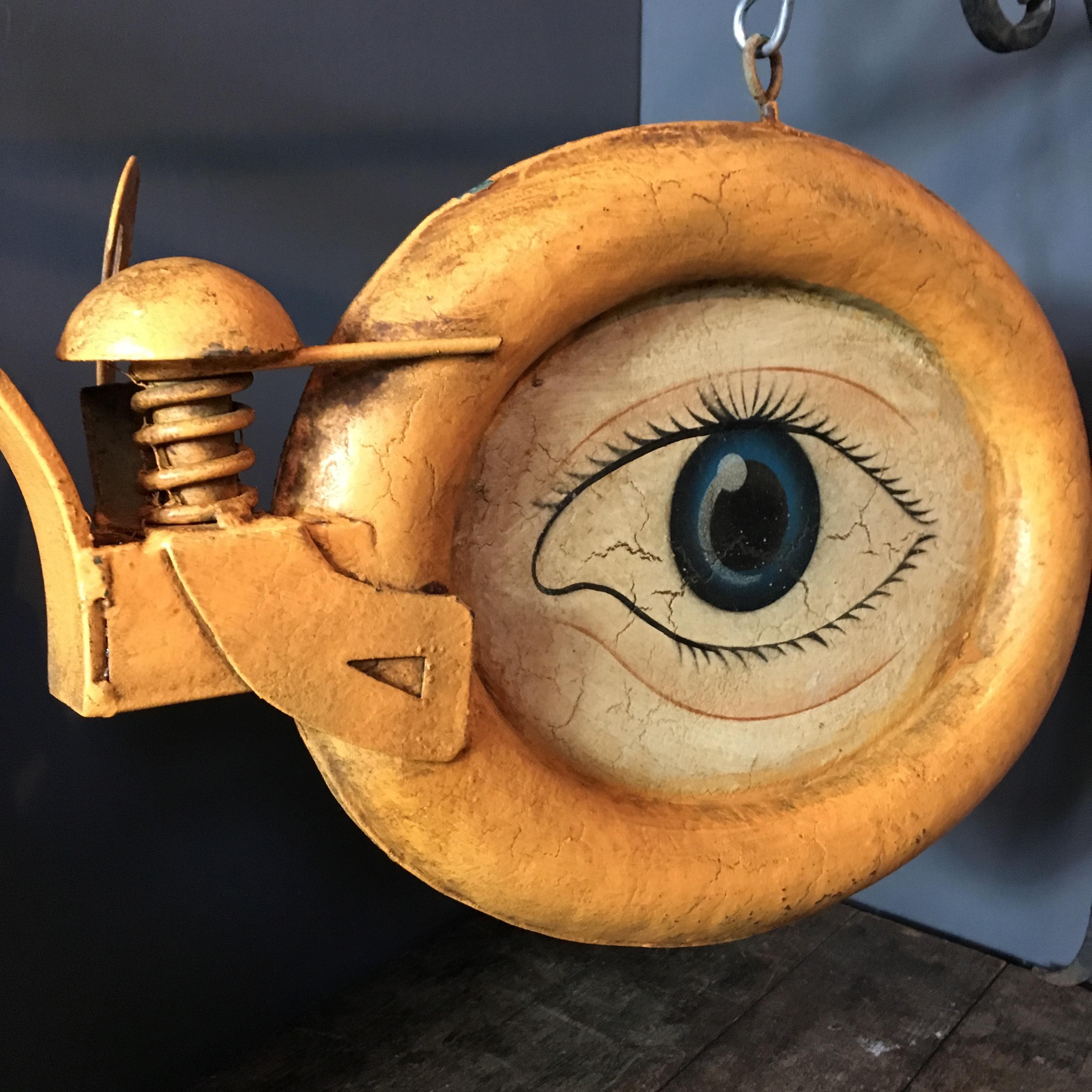 Antique advertising sign for an opticians/optometrist,

circa 1900-1930.

Double sided big cast zinc glasses with four hand-painted eyes.

The eyes hang on the original adjustable iron wall bracket.

Rare and collectable item.