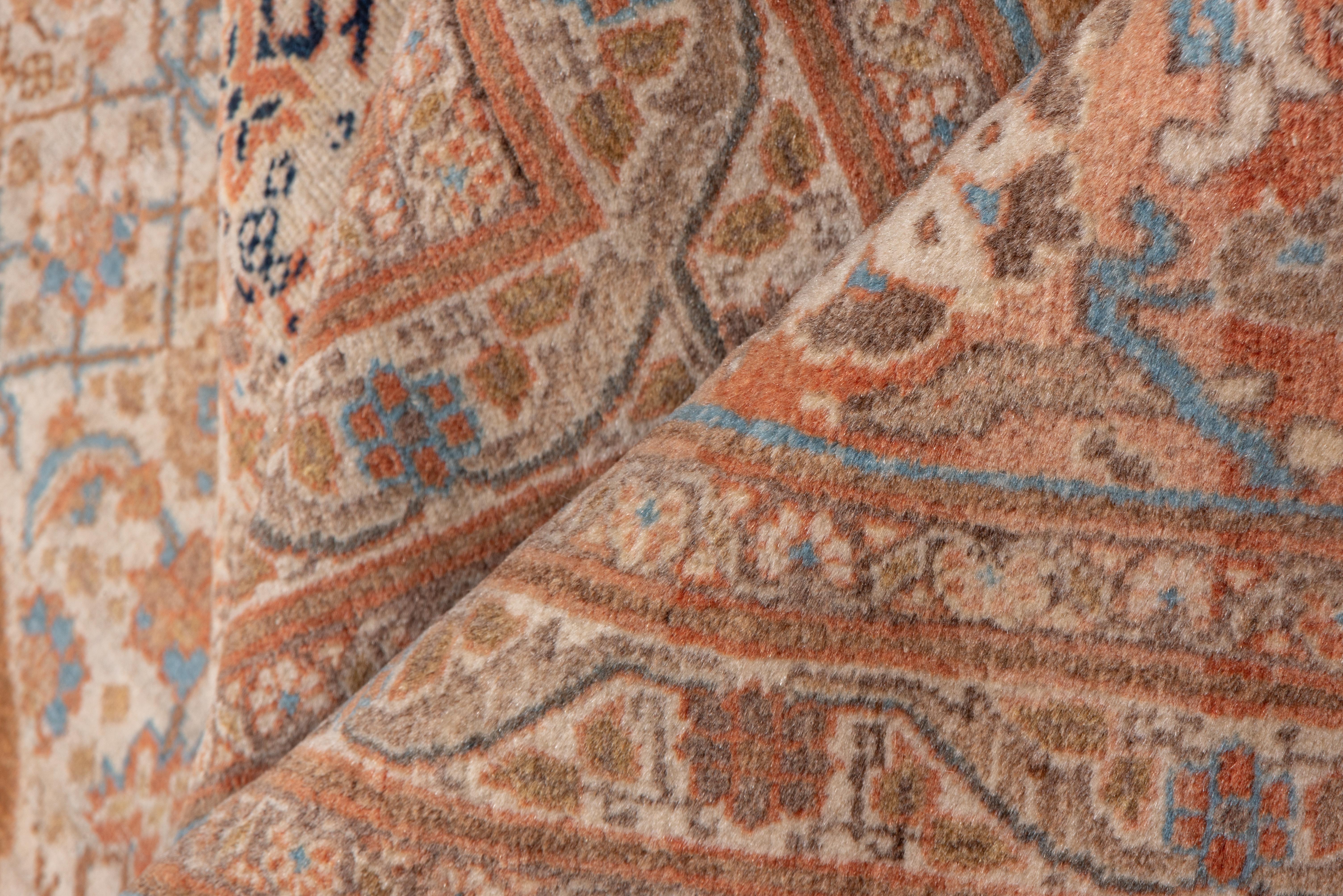 This NW Persian ultra-urbane city carpet features a layered 