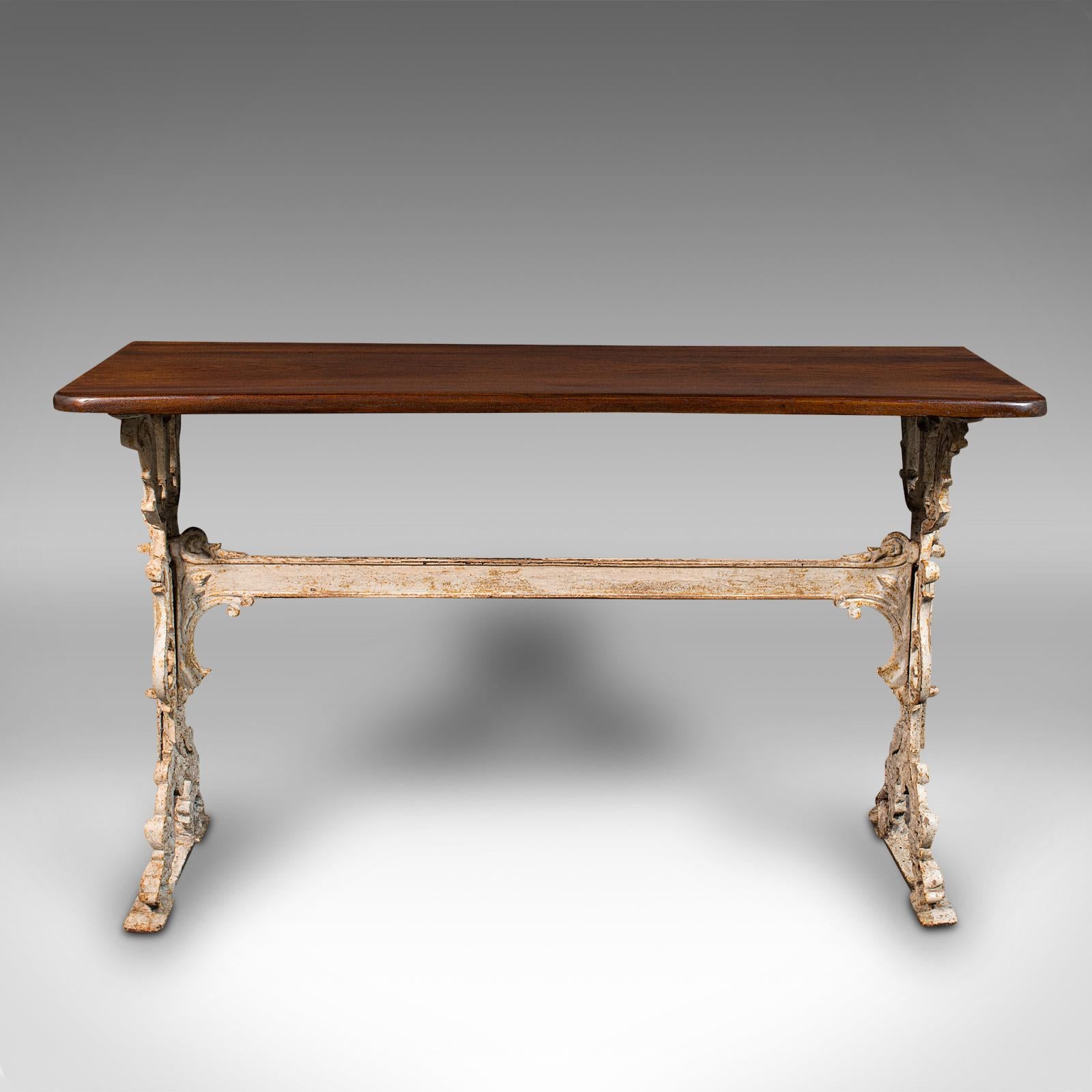 This is an antique orangery console table. An English, walnut and cast iron reception or side table, dating to the early Victorian period, circa 1850.

Grace your orangery or portico with this distinctive console table
Displays a desirable aged
