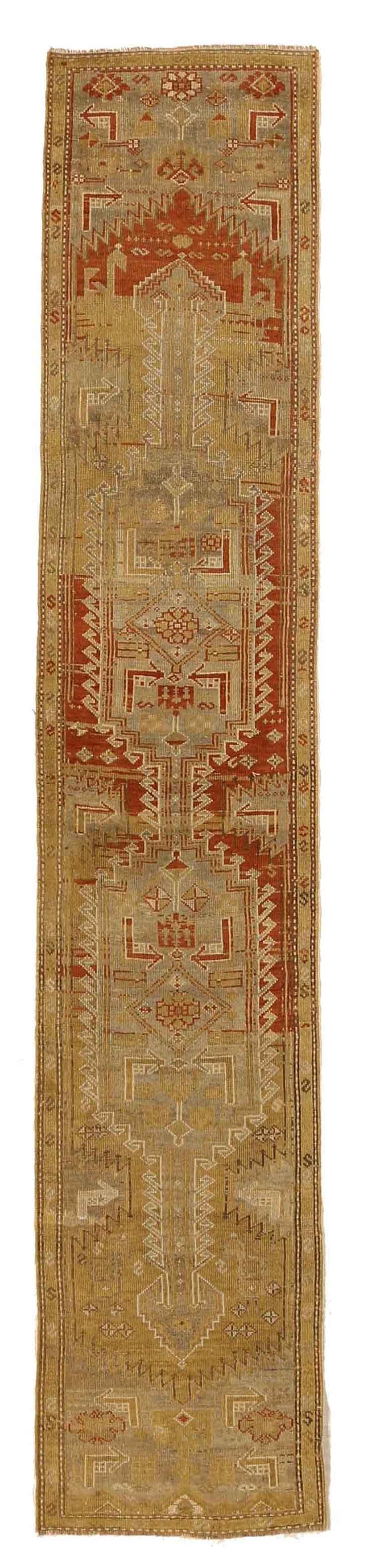 Antique Persian rug made from hand spun organic wool using designs favoured by weavers in Kolayaei, Iran. Color variation showcases the rug’s beautiful aging while the combination of gray, green, and rust with hints of blue is a sight to behold.