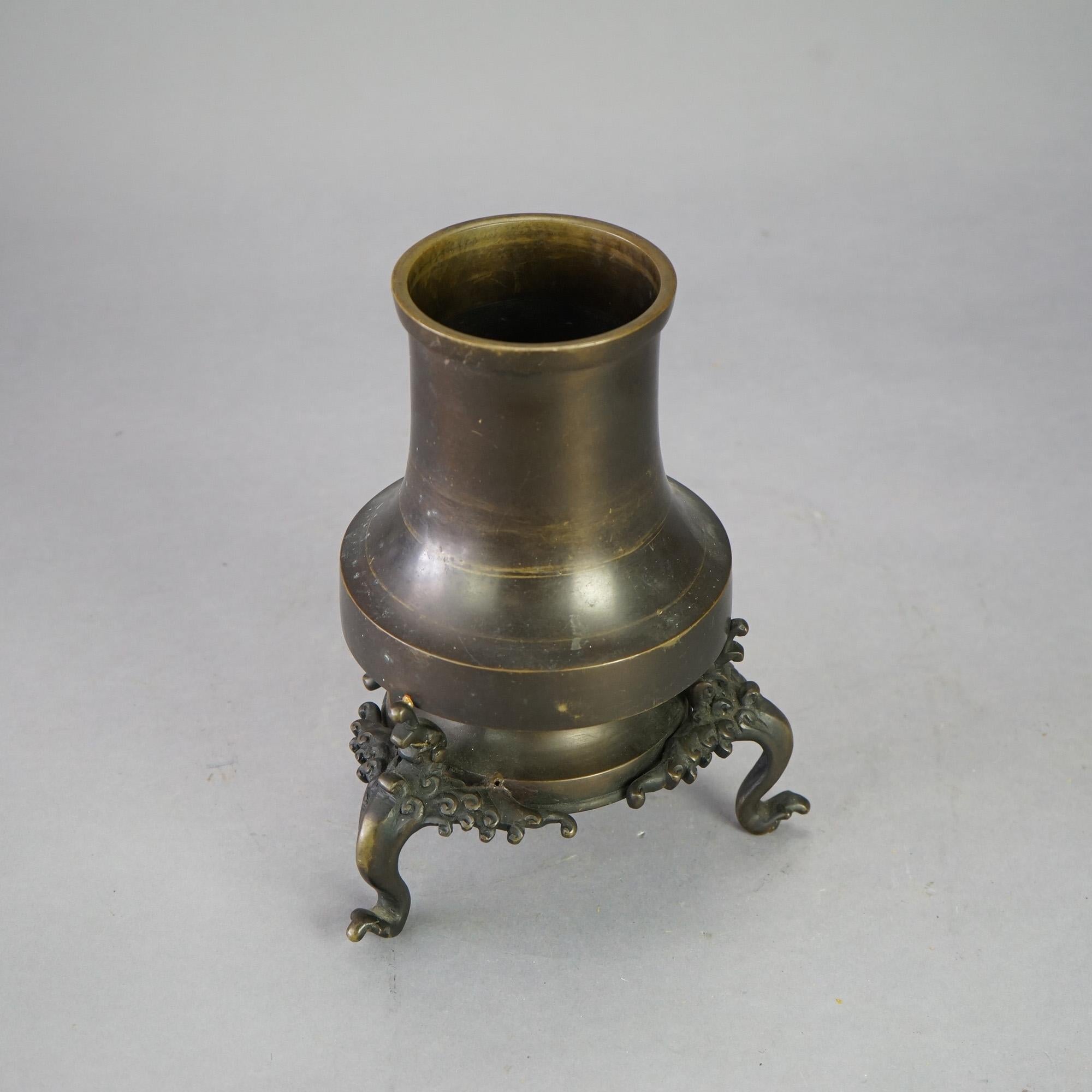 An antique oriental censer offers bronze construction in tower form on footed base having wave or cloud form elements, 19th century

Measures - 10.5