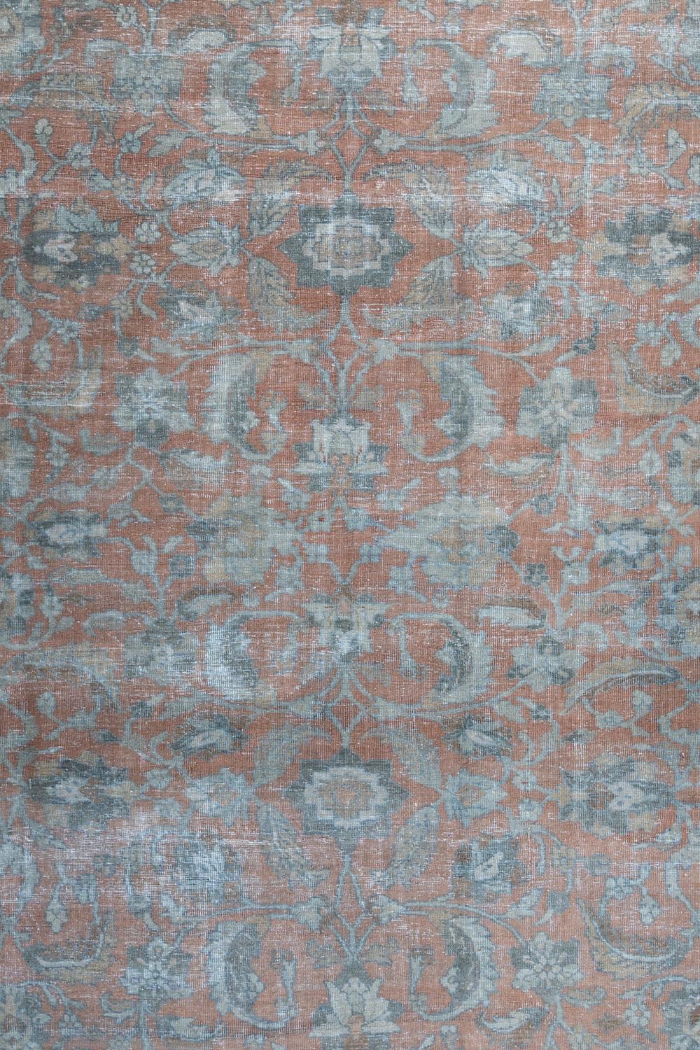 Age: Circa 1940

Colors: salmon, blue, sand, light tan 

Pile: low

Wear Notes: 2

Material: wool on cotton

Large vintage Persian Mahal with a hard to find salmon field. Uniformly dispersed leaves and foliage in shades of blue across the warm