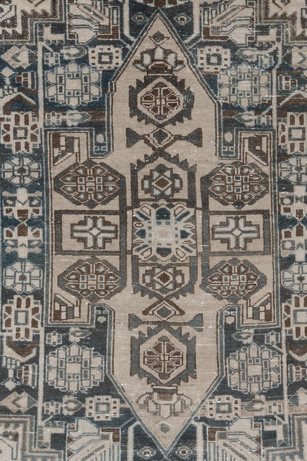 Age: Circa 1940

Colors: blue, emerald, ivory, brown

Pile: medium 

Wear Notes: 4

Material: wool on cotton

Vintage rugs are made by hand over the course of months, sometimes years. Their imperfections and wear are evidence of the hard