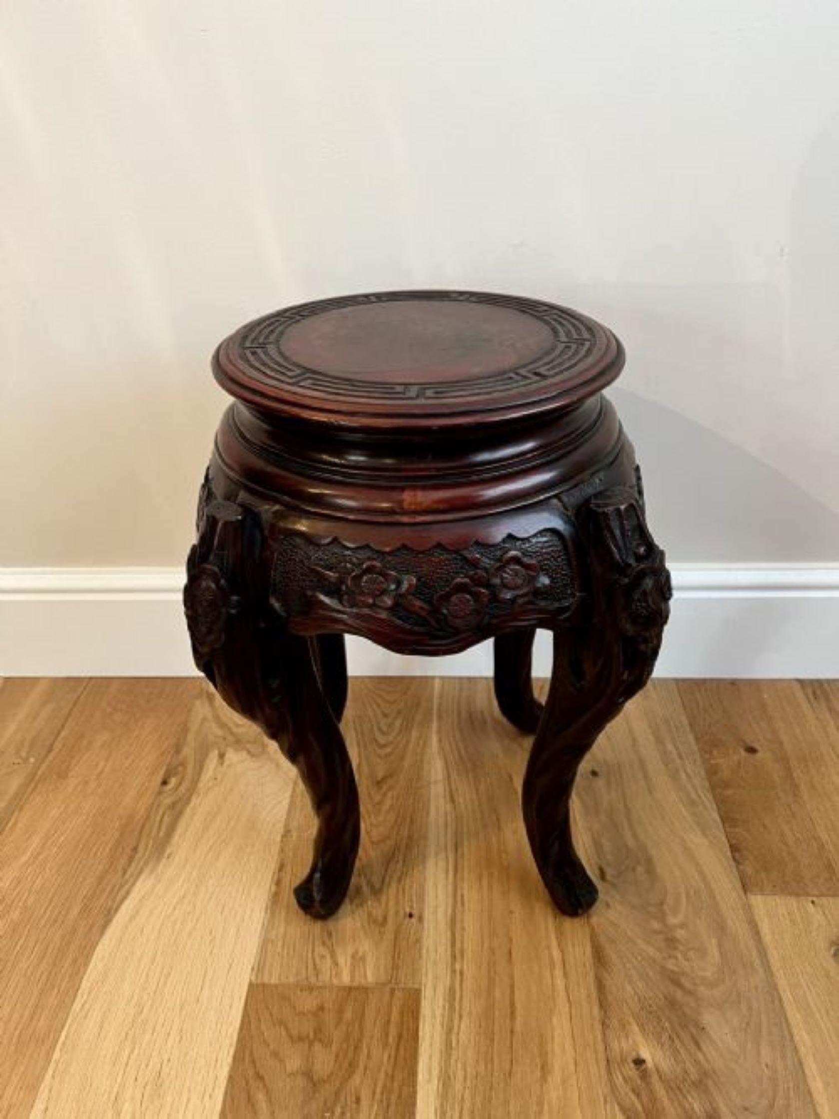 Antique oriental quality carved jardiniere stand having a quality carved circular top above a wonderful carved frieze with flowers standing on four shaped carved cabriole legs with scroll feet 