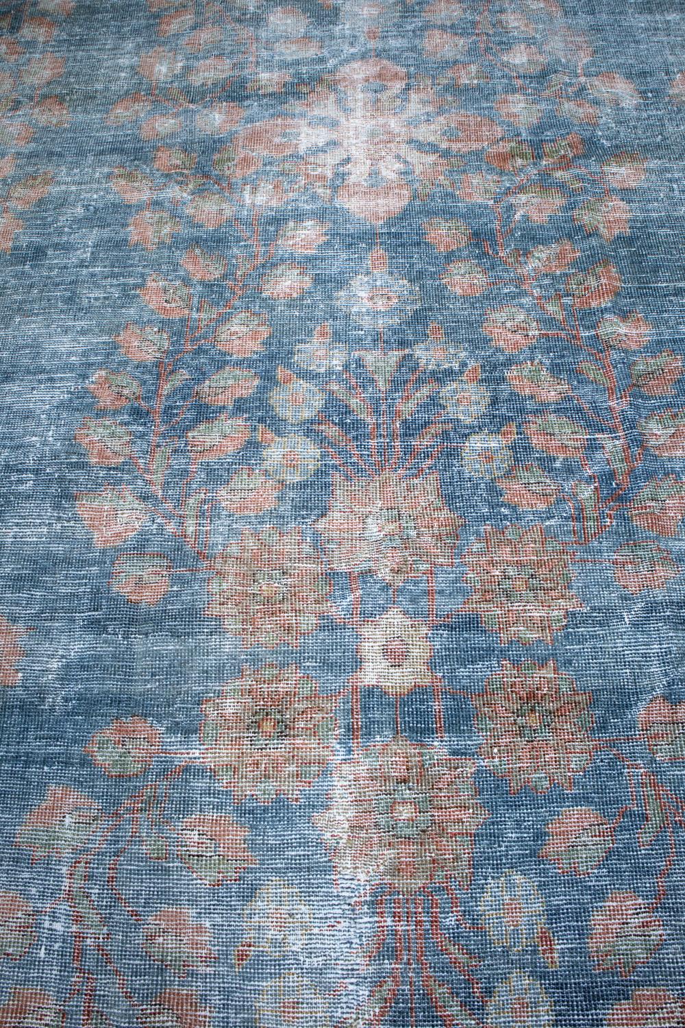 Age: Circa 1910

Colors: blue, faded red, ivory

Pile: low

Material: wool on cotton

Wear Notes: 6-7

Beautiful old Sarouk woven in the early 20th century with lovely even distressing. 

Wear Guide:
Vintage and antique rugs are by nature, pre-loved