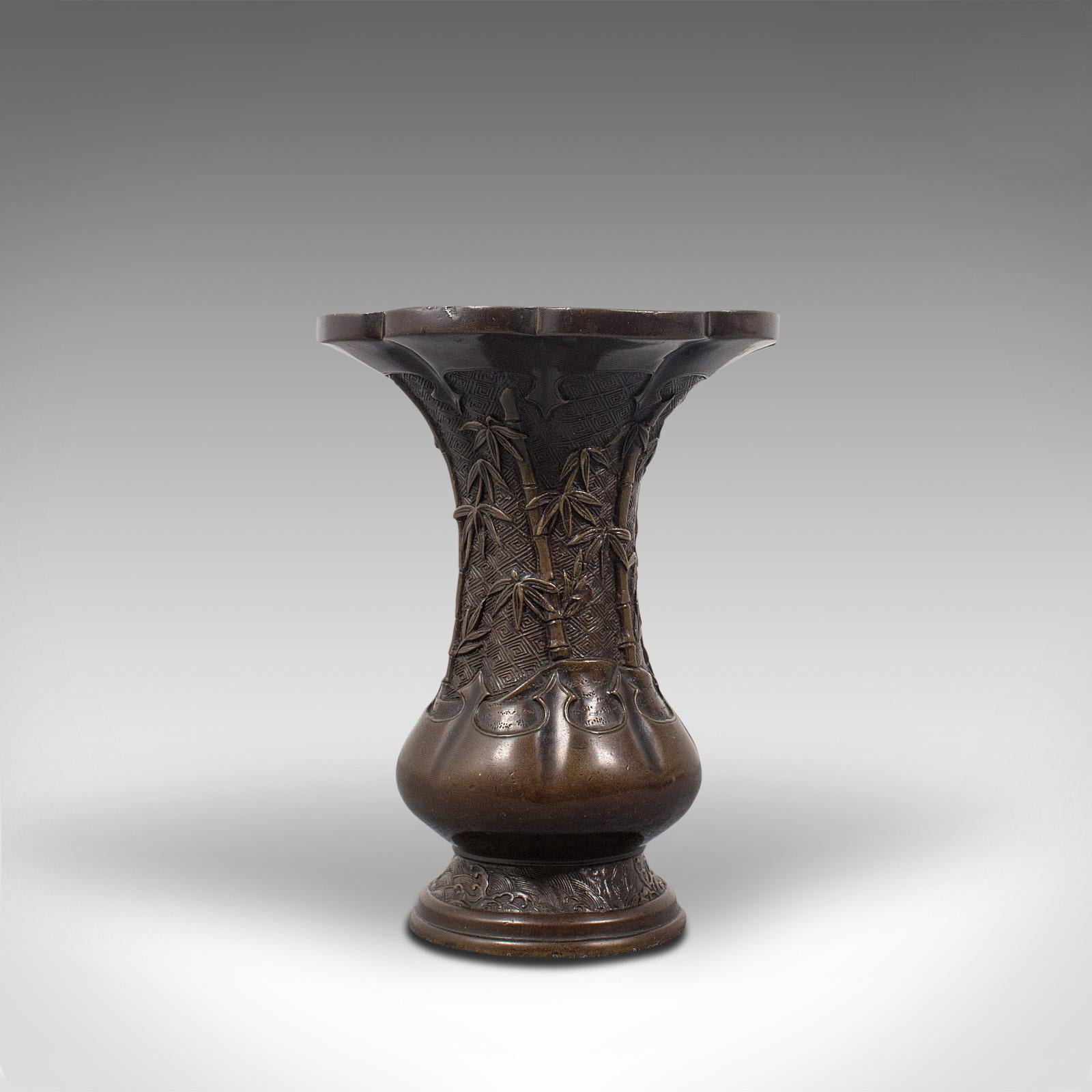 This is an antique Oriental vase. A Chinese, bronze decorative baluster urn, dating to the late Victorian period, circa 1900.

Superb decorative appeal
Displays a desirable aged patina - one small indent under close inspection
Flared bronze with