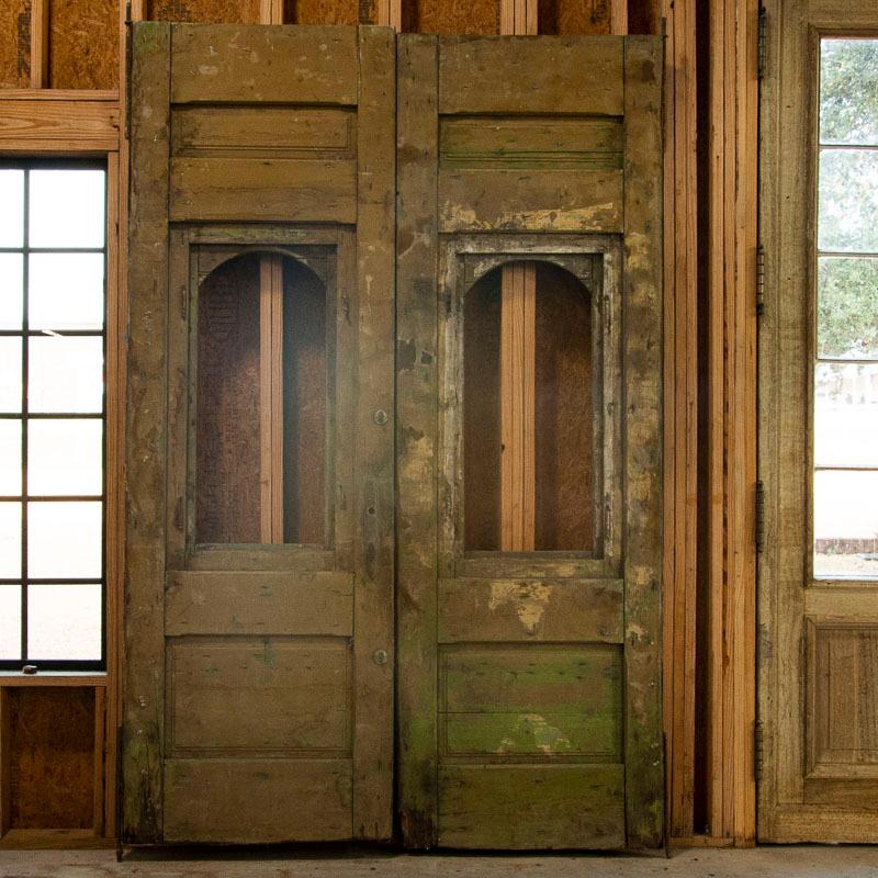 These impressive doors stand over 9' tall with heavily carved details and panels that add drama. At over 9' tall, the grand scale and sheer 